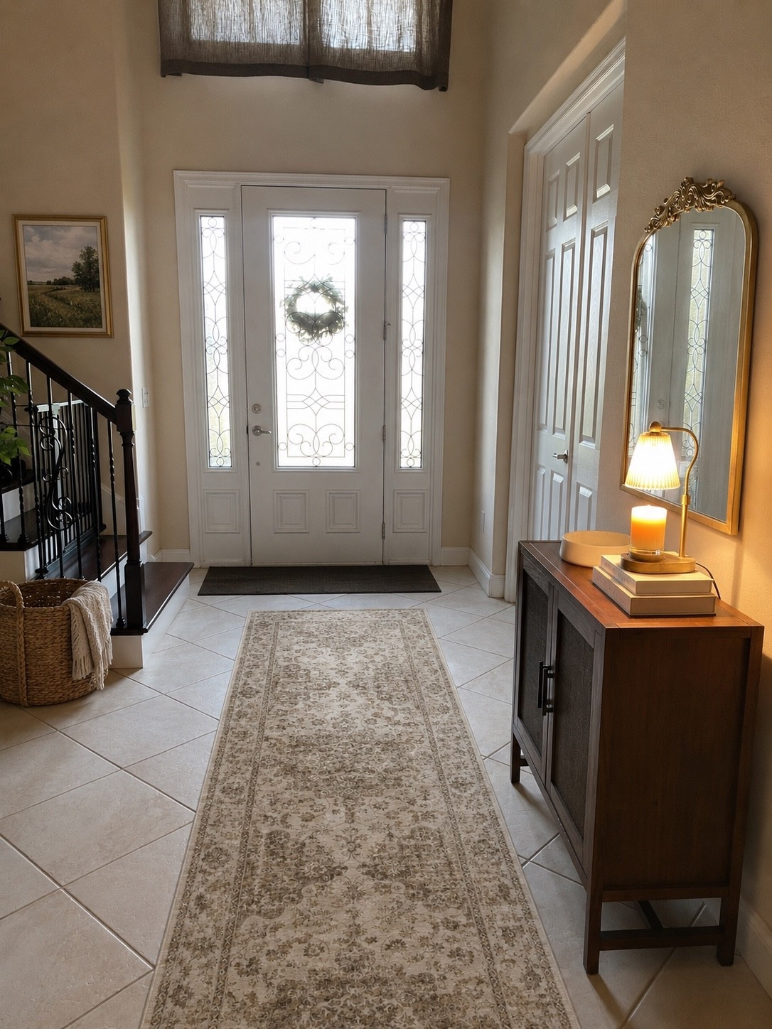 The entryway is the first thing people see, so I love keeping it warm, cozy and inviting. 🤎 A vintage-inspired runner, warm wood cabinet, gold mirror, soft lighting and woven textures make this space feel collected without trying too hard. Proof that you don’t need a huge foyer to make a beautiful first impression.

Entryway decor, entryway ideas, foyer decor, foyer inspiration, entryway styling, entryway cabinet, entryway console, entryway furniture, entryway storage, entryway organization, entryway runner, hallway runner, vintage runner rug, neutral runner rug, washable runner rug, entry rug, neutral home decor, warm neutral decor, organic modern decor, traditional home decor, transitional home decor, cozy home decor, entryway mirror, gold mirror, ornate gold mirror, vintage mirror, wall mirror, entryway lighting, table lamp, cordless lamp, rechargeable lamp, ambient lighting, wood cabinet, accent cabinet, storage cabinet, woven basket, blanket basket, decorative candle, home entry inspiration, foyer design, small entryway ideas, Amazon home decor, Amazon home finds, LTK home, home styling ideas, neutral aesthetic, cozy entryway, welcoming home, front door decor, everyday home decor

#LTKSeasonal #LTKSaleAlert #LTKHome