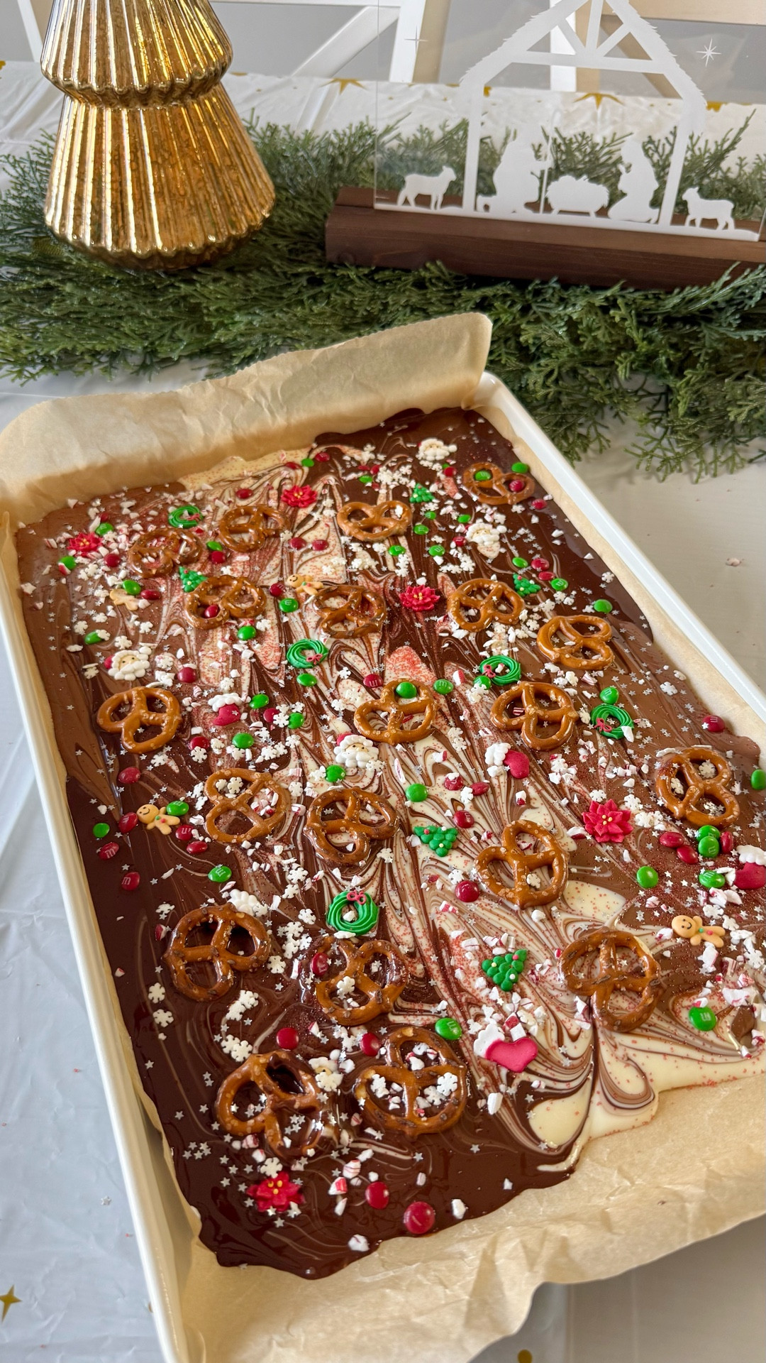 Christmas Bark with festive sprinkles, pretzels, and mini M&Ms.

#LTKfoodie #LTKSeasonal #LTKHoliday