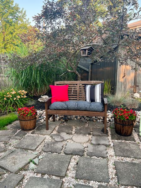 Paver patio views with this acacia wood bench, decorative outdoor throw pillows and wine barrel planters - patio decor - backyard decor - Amazon home - Amazon finds 

#LTKunder100 #LTKSeasonal #LTKhome