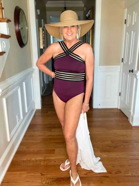 One piece swimsuit in color Merlot! This suit comes in so many good colors and prints. White beach cover up | womens hat | vacation 

#LTKstyletip #LTKover40 #LTKswim