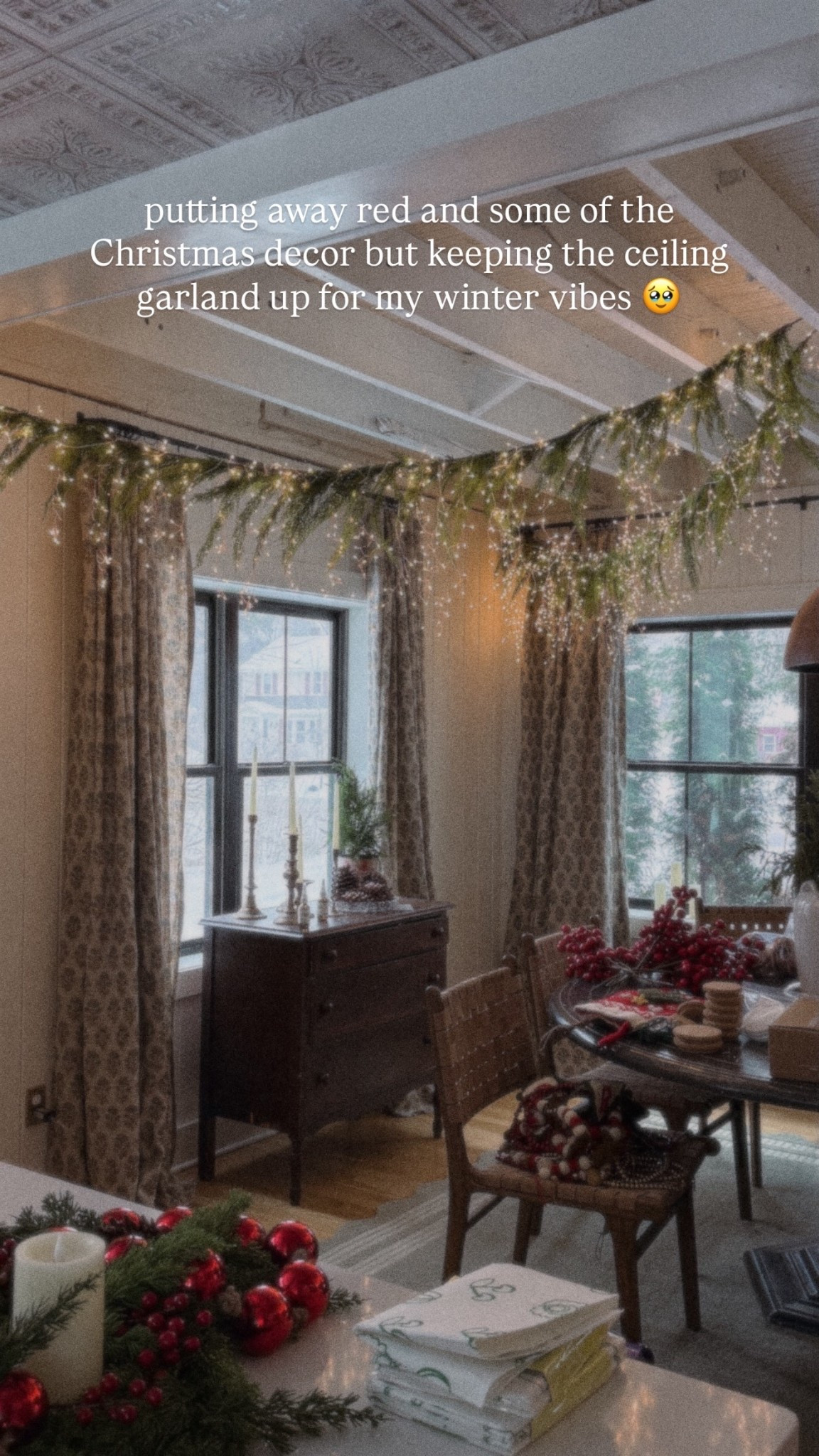 putting away red and some of the Christmas decor but keeping the ceiling garland up for my winter vibes 🥹