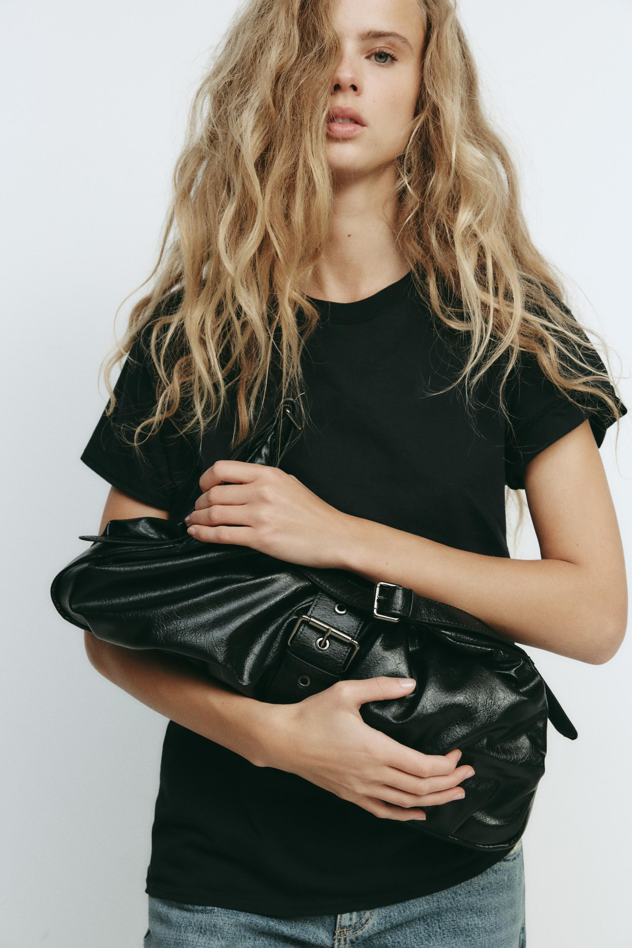 Maxi bucket bag with gathering detail and decorative buckle. Adjustable shoulder strap. Interior ... | Zara US