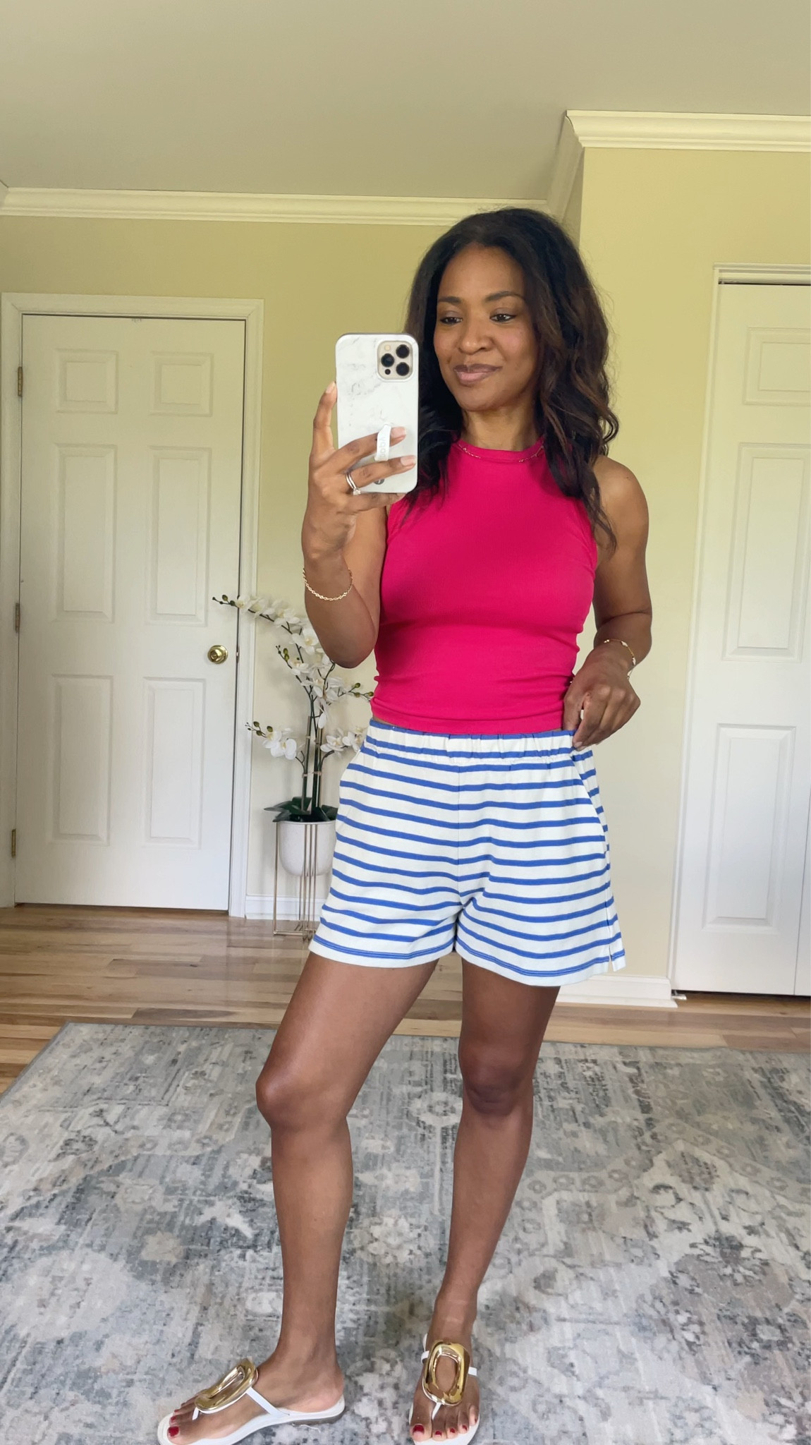 Wearing a medium in the top (I recommend sizing up at least two sizes if you have a large cup size like I do). And wearing a small in the shorts which are TTS  

 #ltkover40 #ltkootd #ltkgrwm