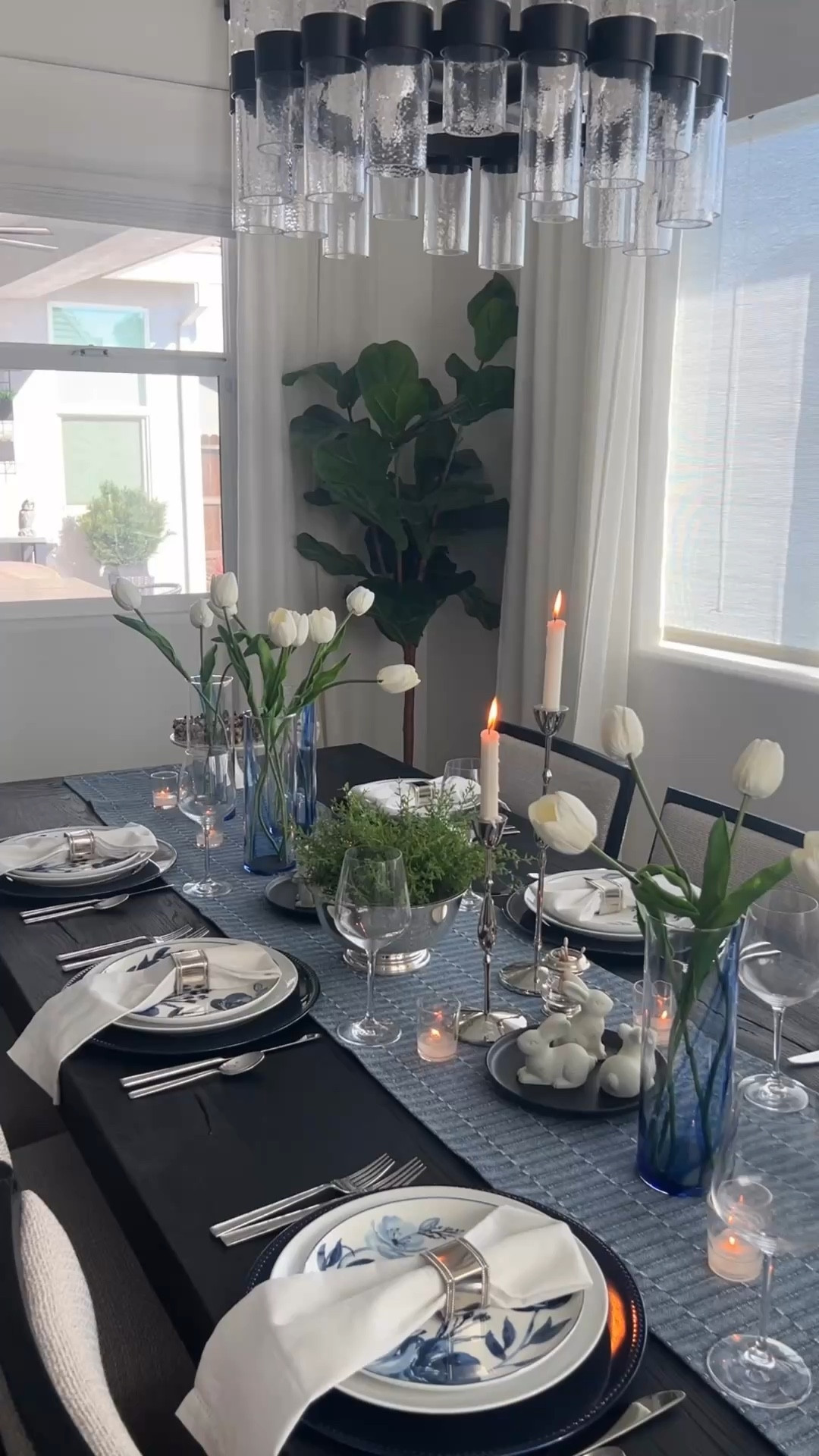 A moody Easter table layered with blue, white, and classic silver for a modern, elevated take on spring hosting. moody easter table, blue and white table, spring tablescape, modern hosting, silver serveware, neutral table decor, blue and white floral salad plates, glass water pitcher, white dinner plates, layered place setting, elegant table styling, easter brunch table, spring entertaining, classic home dec

#LTKHome #LTKSeasonal