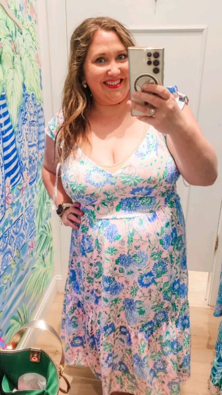 This is the Bayleigh Midi. I tried the other print in this dress a few weeks ago. It runs Large IMO even though it is a zip up dress it has a smocked back which gives it extra room in the chest. It does have built in cups in the top if you do not want to wear a bra. The waist pulls in nicely to give you shape as well. If this had better sleeves I think I would be all about it but I agree with my husband's comment of how it looks tacky when the sleeves move and it's white underneath. #livinglargeinlilly #lillytryons #grandmillennial #lillypulitzer #plussize 

#LTKmidsize #LTKplussize #LTKwedding