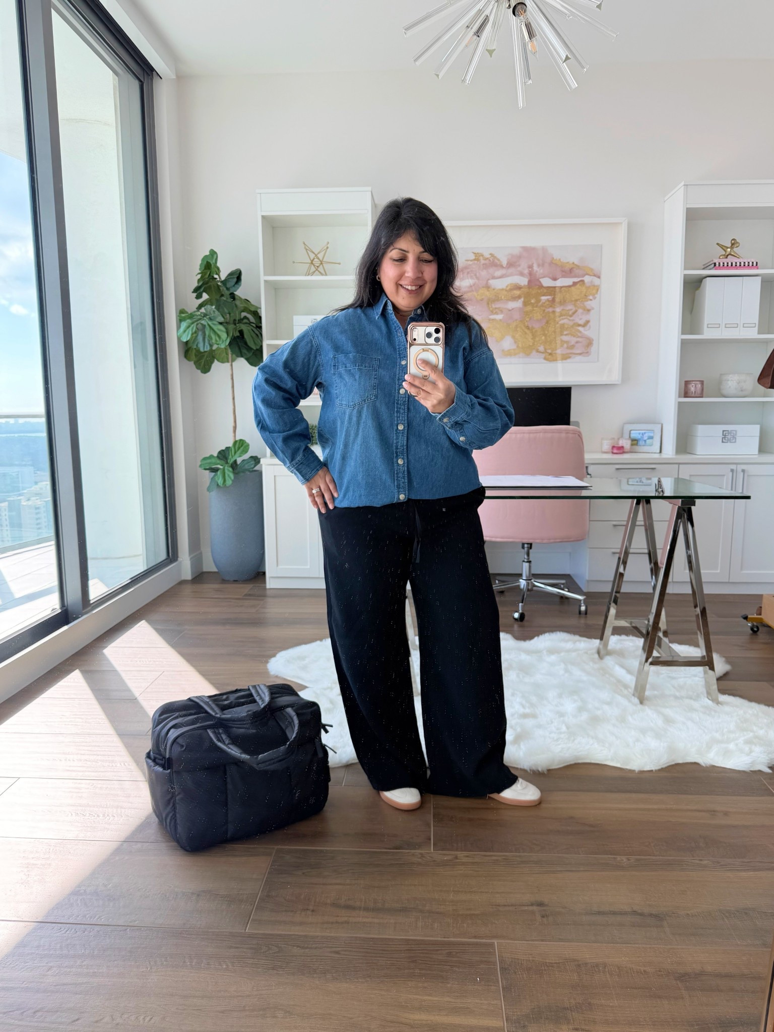 Aritzia Winter Sale! Up to 50% off ! This brand is new for me and I’m trying some new to me pieces that live up to the rave reviews! 

Aritzia denim shirt size Small. Runs big and is very generously cut with an oversized fit. So soft and comfy and not stiff at all. Aritzia Lodge pants in size large short. Love the crepette material that’s perfect for travel and can be worn casually with sneakers as seen here or dressed up with flats or heels for a dressier look. Perfect for workwear too. Such a versatile pair of black pants to have in your wardrobe. Available in lots of colors and 3 different lengths (regular, short and tall)! Adidas handball Spezial sneakers. These run big so size down. I normally wear a 7.5 or 8 in shoes and I wear these in size 7. CALPAK Luka duffel bag.

Perfect gifts for the frequent traveler and such a great travel outfit! 


#LTKMidsize #LTKOver40 #LTKPetite