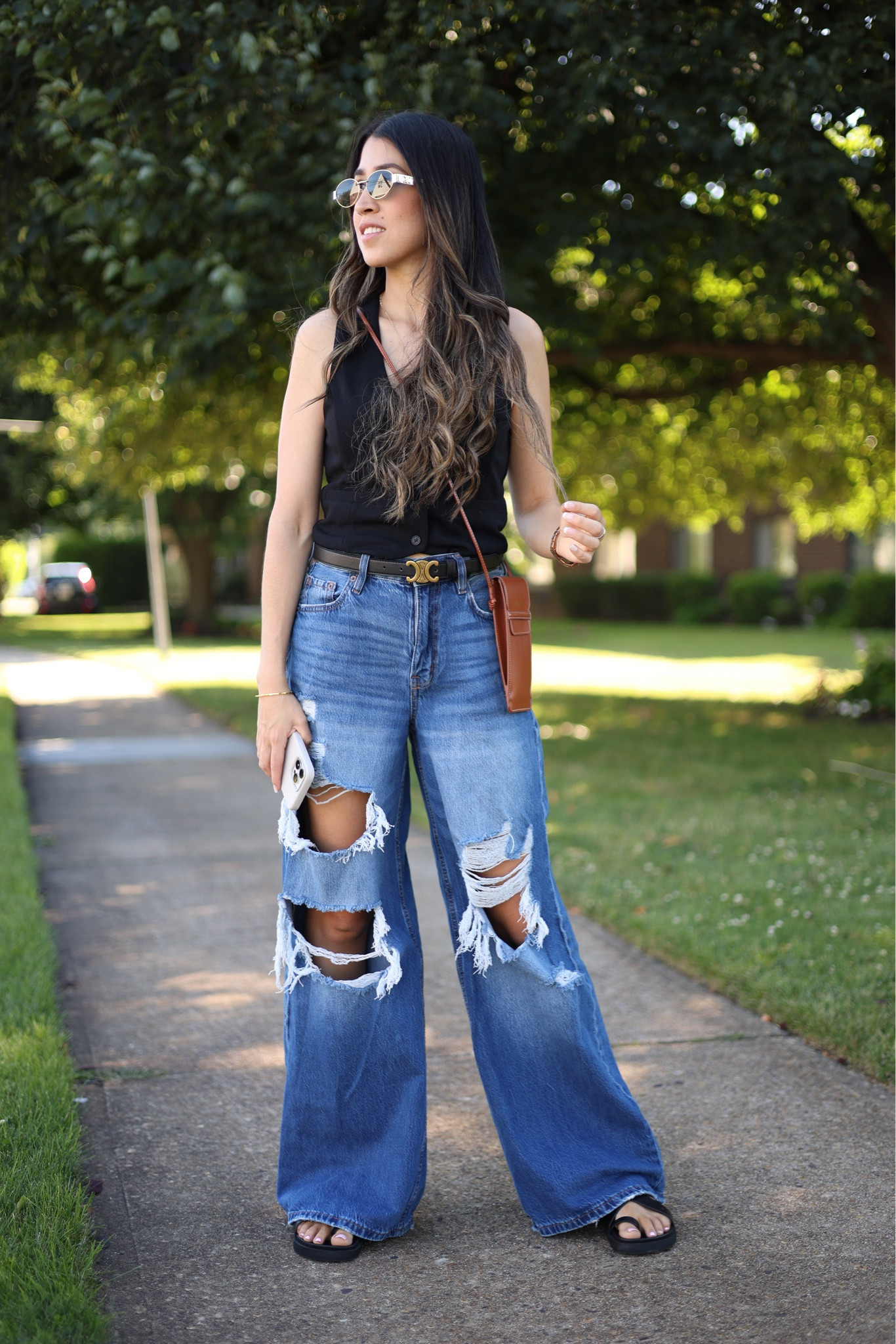 Casual summer outfit idea! Rocking a pair of ripped jeans and a black women's vest, paired with comfy sandals and I elevated it with Celine accessories, belt and trendy sunglasses.

#LTKStyleTip #LTKSummerSales #LTKxNSale
