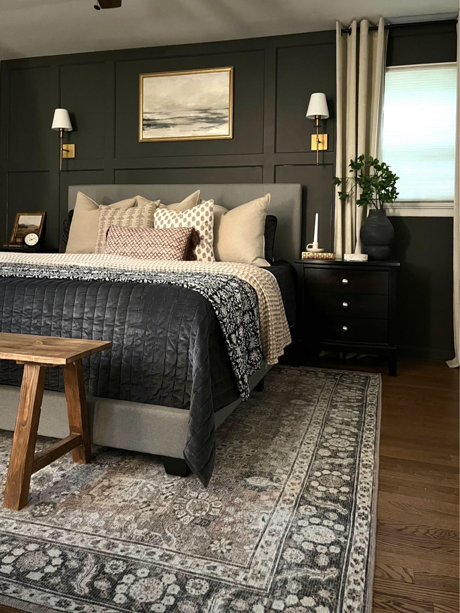 Moody bedroom, primary bedroom, master bedroom, washable rug, black bedroom, brown bedroom, neutral bedroom, kantha quilt, gold sconces, black nightstand, wall art, wood bench

#LTKsalealert #LTKSale #LTKhome