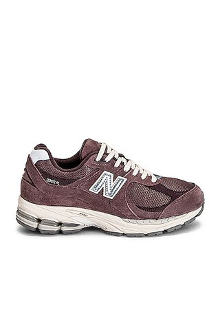 New Balance 2002R Sneakers in Black Fig & Pebble | FWRD | FWRD 