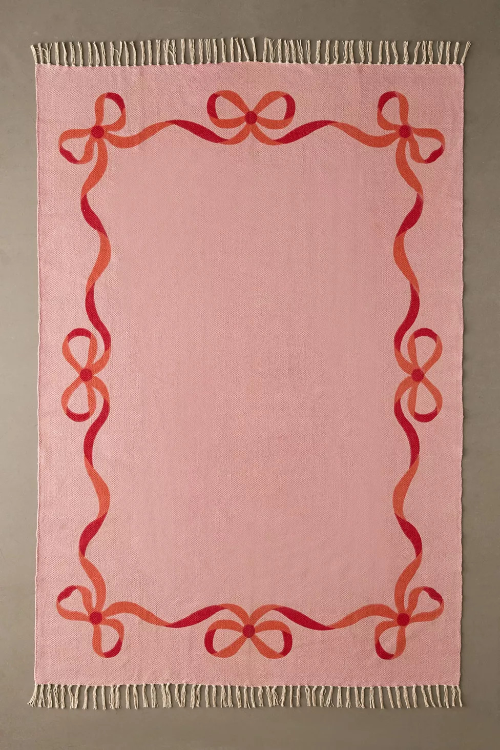 Lacey Bows Unbrushed Printed Rug | Urban Outfitters (US and RoW)