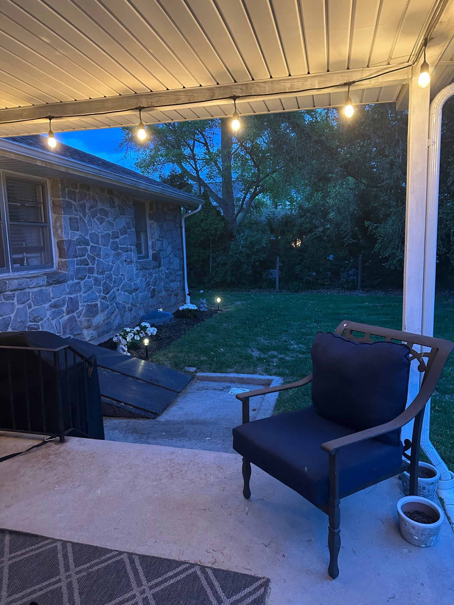 Back patio refresh complete! Just a few cozy touches like string lights, a comfy chair, and some cute planters made all the difference.

#LTKHome #LTKSeasonal #LTKGiftGuide