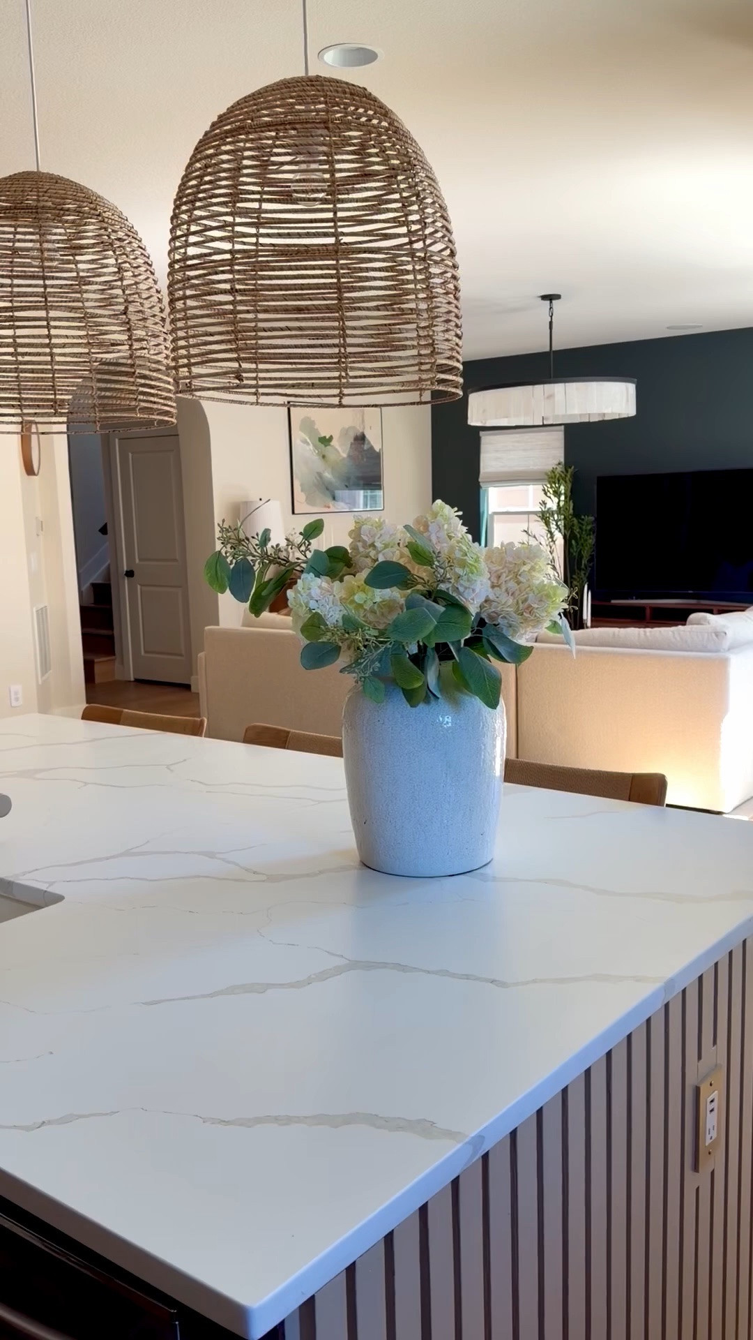 
A moody wall moment 🤍

This space is proof that a darker paint color can completely elevate your home—especially when layered with soft neutrals, warm wood tones, and textured pieces.

I kept everything else light and organic to balance the depth of the wall color… creating that calm, curated feel we all want.

Shop this living room—lighting, media console, accent chairs, pillows, and decor—linked here ✨