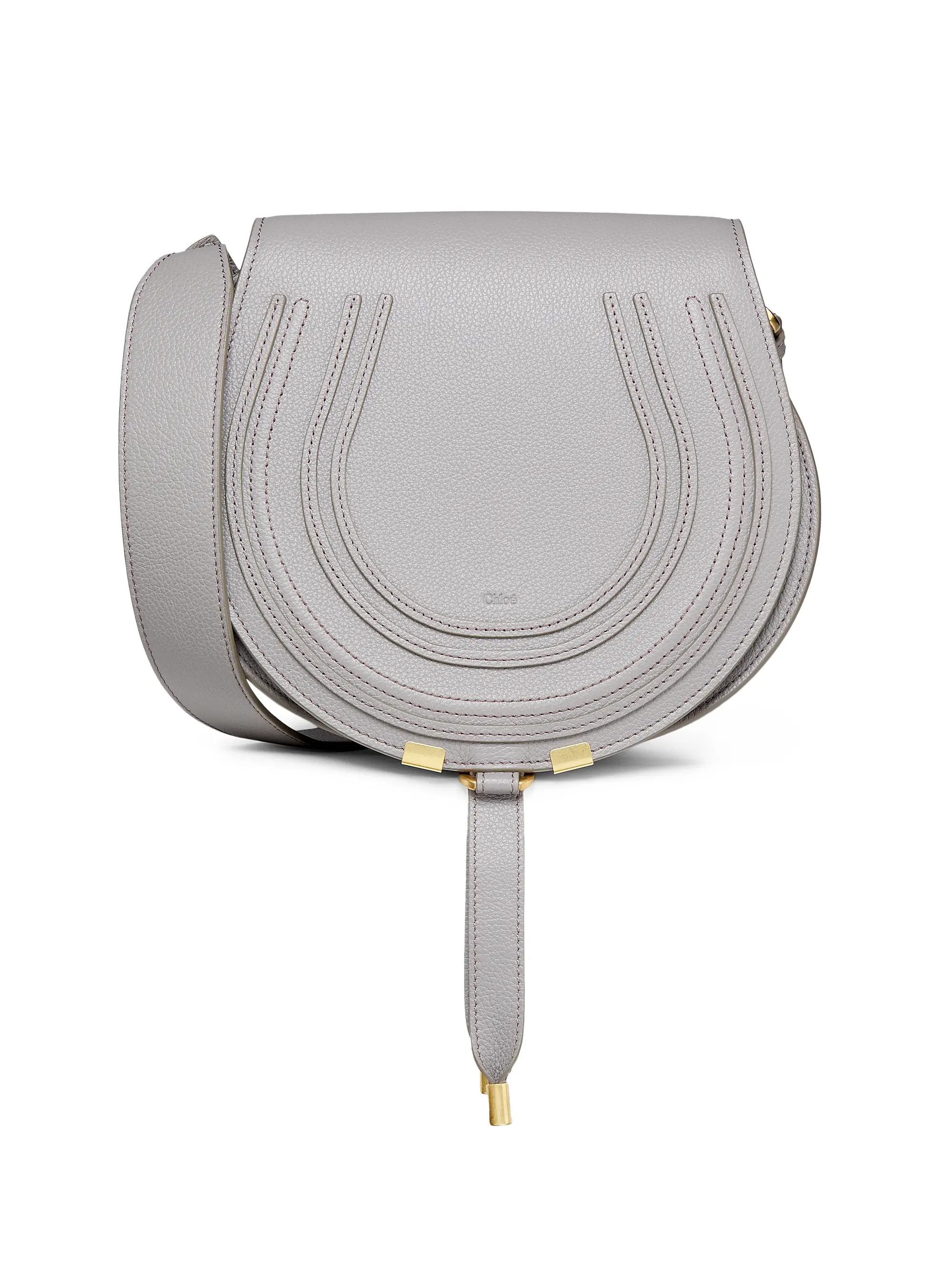 Chloé's Marcie saddle bag is crafted of luxurious leather and designed with a flap closure. | Saks Fifth Avenue