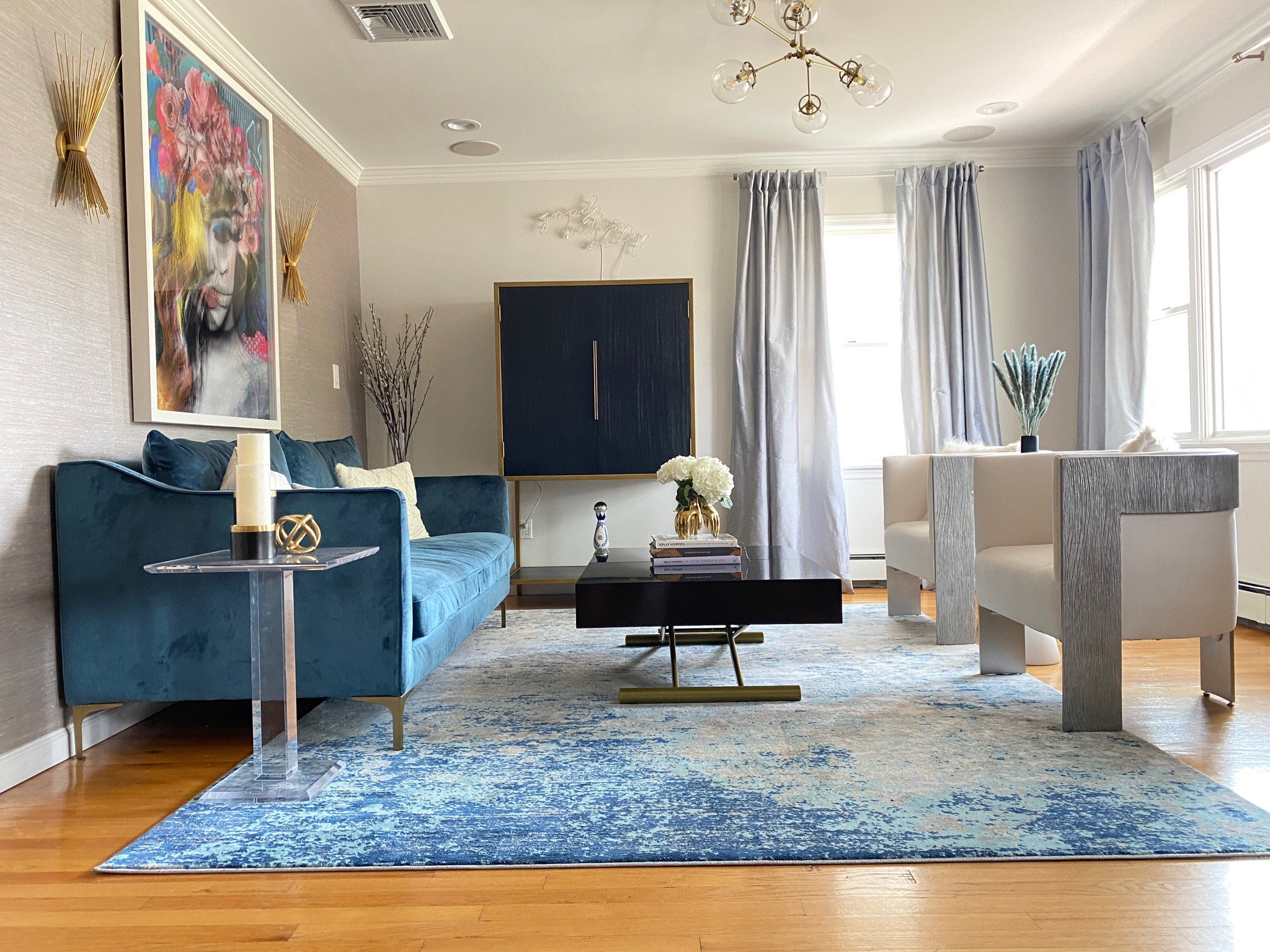 Living room update // blue velvet sofa, abstract area rug, ivory accent chairs, silver curtains 

#LTKFind #LTKhome #LTKstyletip
