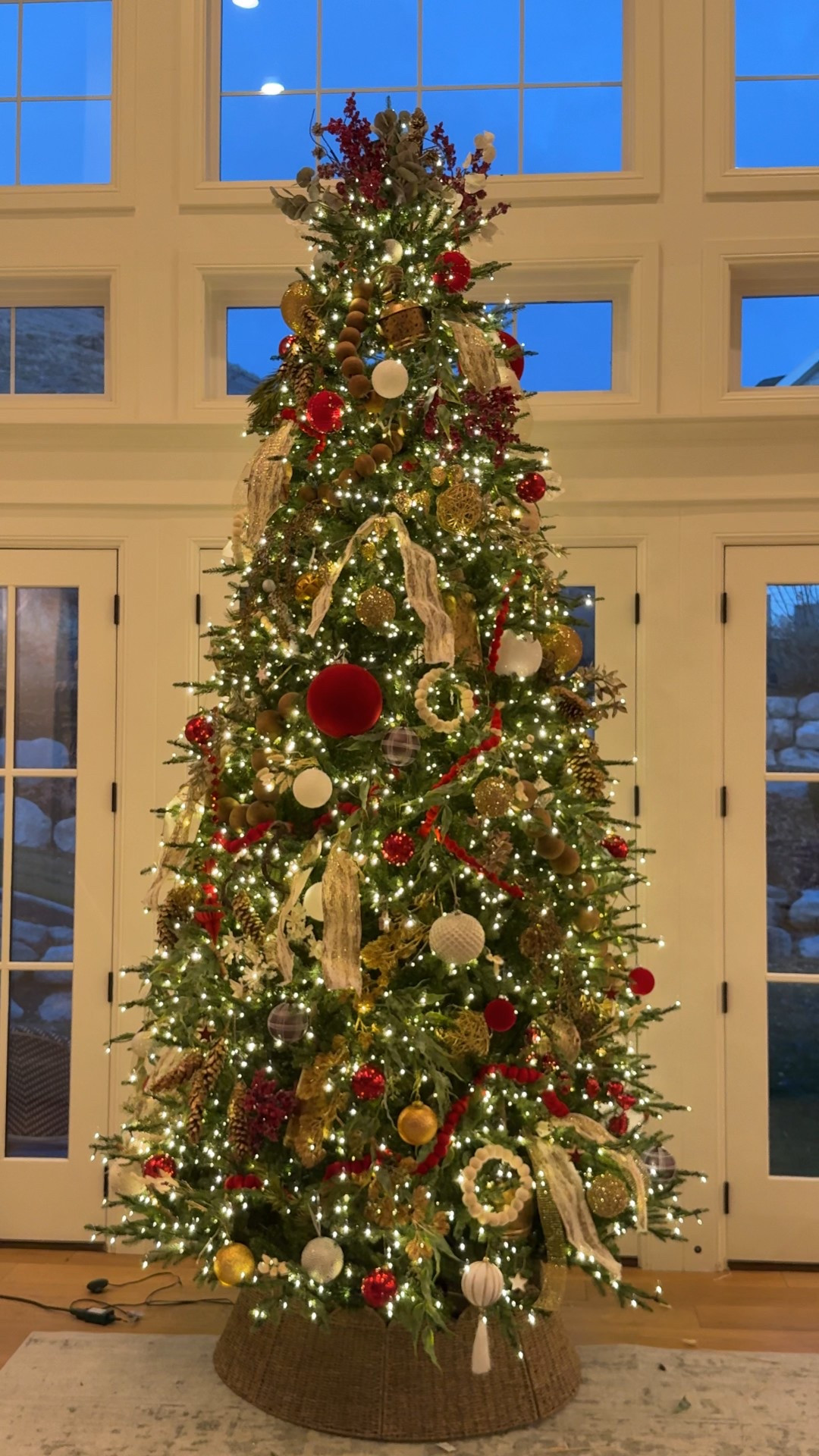 Bring the Christmas magic into your home this  12 ft. LED Pre-Lit Artificial Christmas Tree. This tree features realistic evergreen branches with 8,308 durable branch tips and 2,000 color-changing micro fairy LED lights. 9 light functions: Warm White Steady, Warm White Flashing, Warm White Slow Fade, Multi Steady, Multi Flashing, Multi Slow Fade, Warm White/Multi Sequential, Warm White/Multi Color Changing and Combination. This HAH tree features Quick Set technology which integrates the power cord into the trunk of the tree with only one plug making set up easy. Connect each section then watch your tree shine bright. Tree includes an easy on/off foot pedal, remote control and metal stand included.

Pre-Lit Jackson Noble Fir artificial tree completes your holiday decor
Indoor Use Only
Artificial noble fir Christmas tree measures 12 ft. H and has a 70 in. base diameter when fully shaped
2,000 color-changing micro fairy LED lights
9 light functions: Demo, Warm White Steady, Warm White Flashing, Warm White Slow Fade, Multi Steady, Multi Flashing, Multi Slow Fade, Warm White/Multi Sequential, Warm White/Multi Color Changing
Energy-efficient LEDs deliver lasting illumination
8,308 evergreen branch tips; branch style is realistic
Quick Set technology allows easy assembly and electrical connectivity
Easy ON/OFF foot pedal, remote control and metal stand included
Remote requires (1) CR2025 3V battery, included

#LTKSeasonal #LTKGiftGuide #LTKHoliday