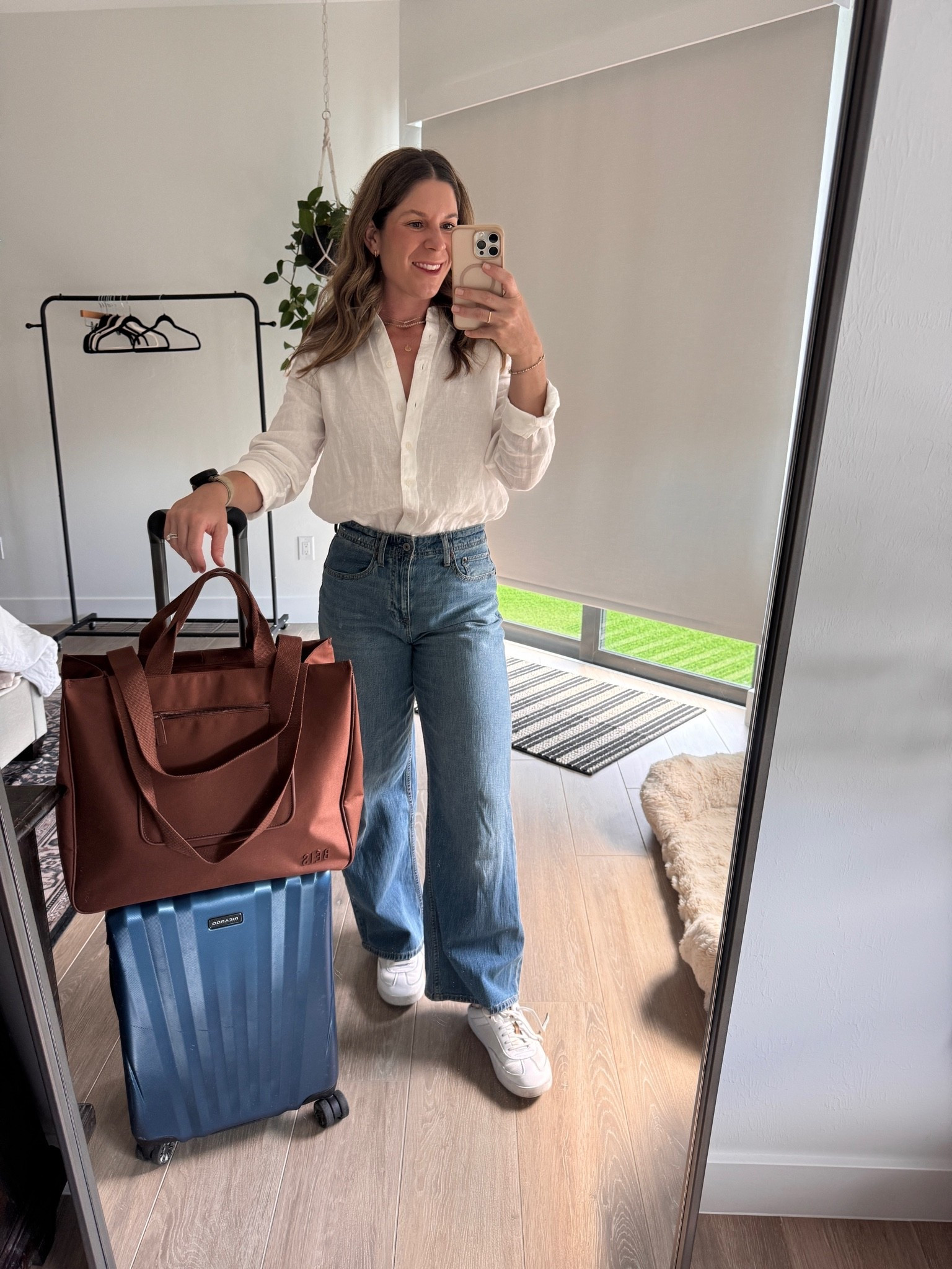 Travel ✈️ day finally feels complete now that I’ve invested in the PERFECT travel bag - the BEIS East to West Tote. 

Per usual my QUINCE linen button-down (wearing a medium)  is a go to because linen doesn’t have to look perfect so it makes an easy travel fabric & of course my linen denim jeans I’ve been wearing all summer long (size 26) 

My olukai slip on leather sneakers are so comfortable and a go to for me time and time again (just size up a half size)