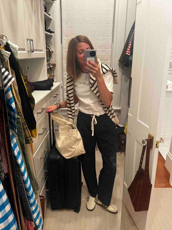 Travel day, but make it cute and comfortable ✈️ This effortless airport outfit pairs relaxed black drawstring pants with a crisp white tee, a striped sweater draped over the shoulders, comfy sneakers, and an oversized tote that is ready for all the travel-day essentials. Easy layers, neutral tones, and plenty of comfort make this the kind of look that goes from boarding gate to destination with zero fuss. 🧳🤍✈️

#TravelDayOutfit #AirportOutfit #TravelStyle #ComfyTravelOutfit #CasualStyle #StripedSweater #WideLegPants #SneakerStyle #AirportStyle #TravelFashion 

 #LTKootd #LTKTravel