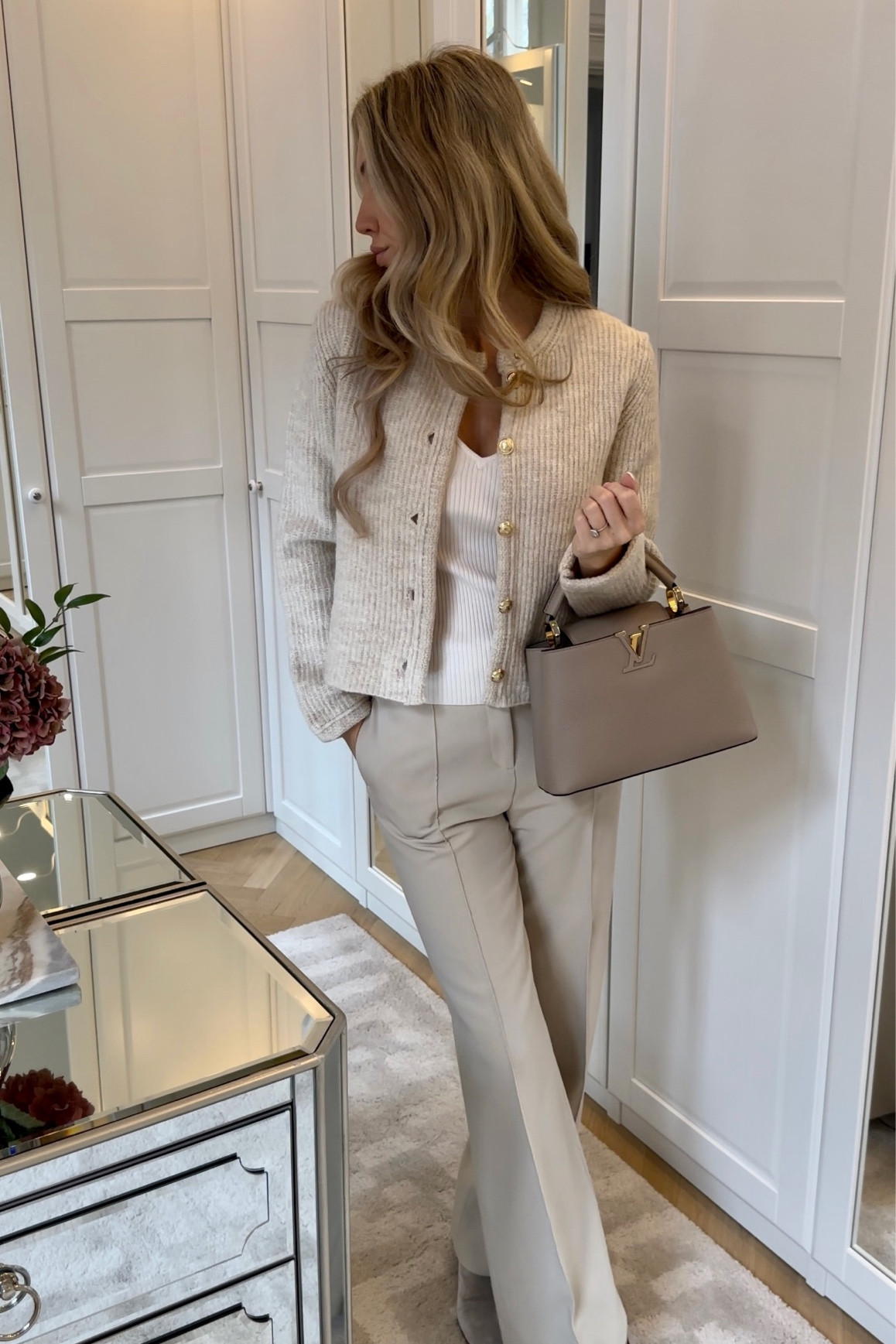 The perfect beige knit cardigan with beautiful gold buttons and a chic waist detail at the back. Giving Celine vibes but a much better price. Wearing a size small🤍 #chicstyle #comfychic #casualchic #cardigan #fallfashion

#LTKworkwear #LTKstyletip #LTKSeasonal