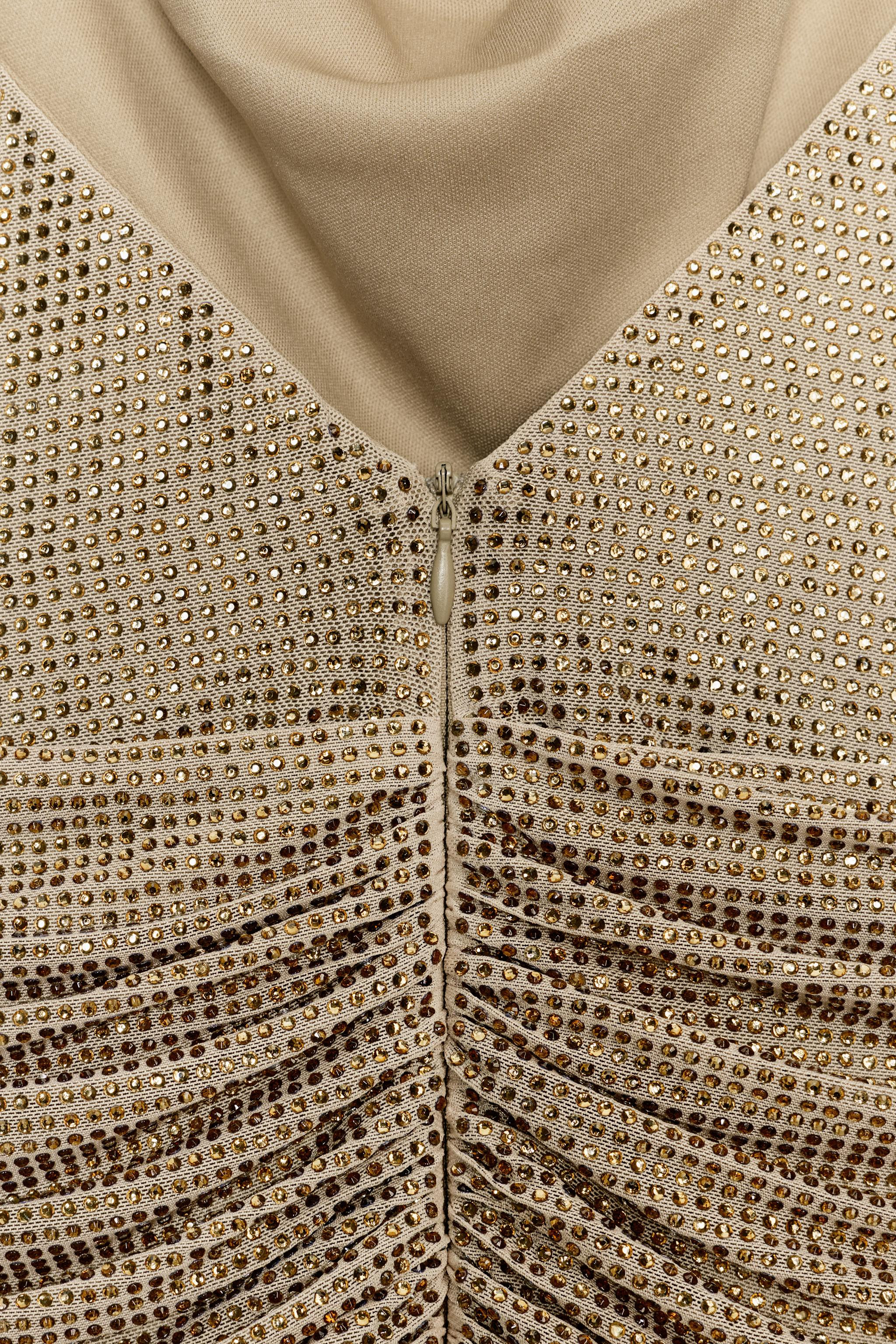 Halter neck dress with a draped neckline. Featuring ruching and sequin embellishments. Tonal inne... | Zara US