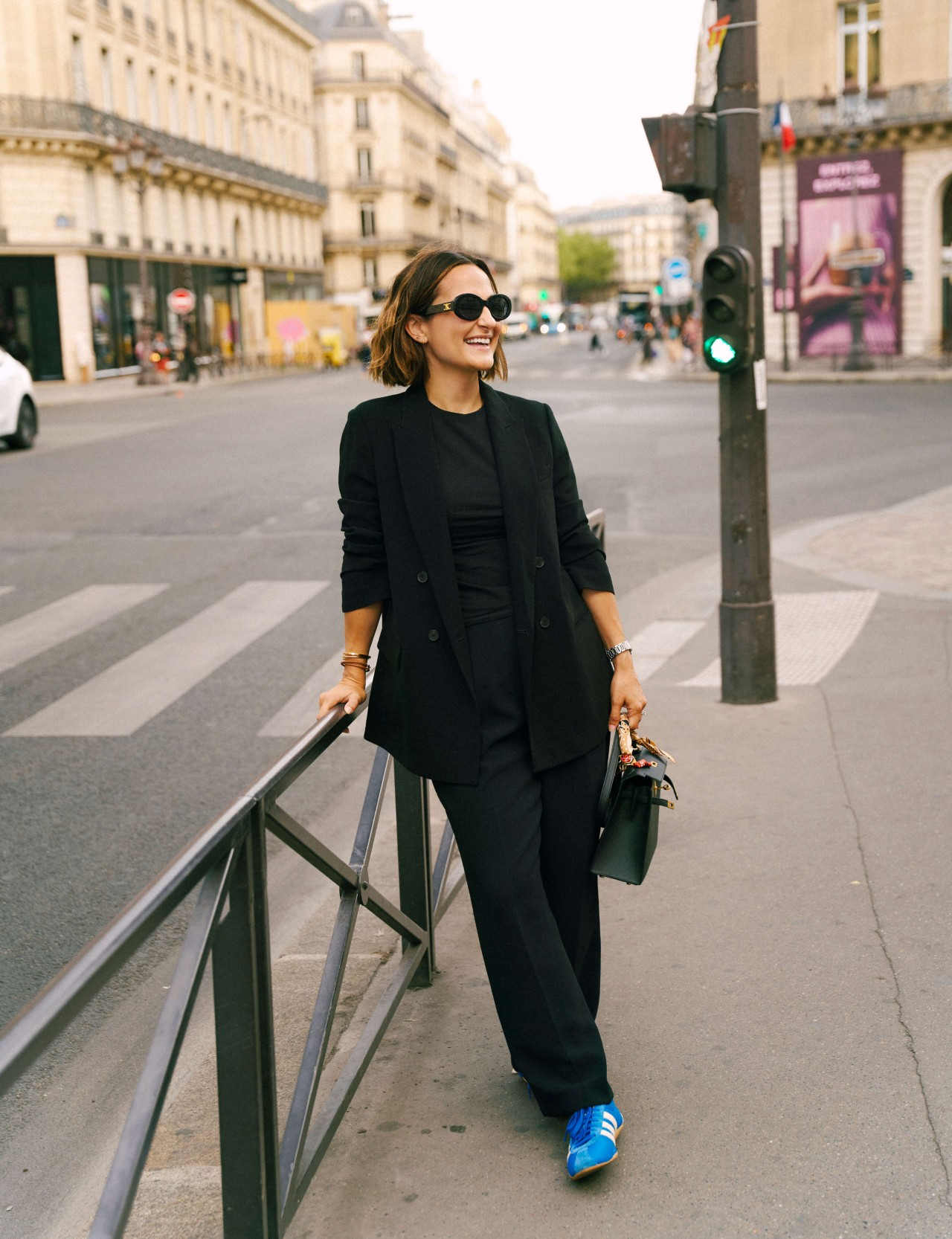 My favorite way to make wide-leg trousers feel a little more relaxed: add a classic blazer, a simple tee, and colorful sneakers. The bright blue pair gives this all-black outfit a fun pop of color while still keeping it chic enough for a day in Paris.  

 #LTKootd #LTKSeasonal