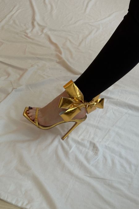 Festive shoes that look like a present 🎁
EGO gold wrap shoes | Bow shoes | Loewe bow shoes dupe | Gold heels | Party shoes | Christmas outfit ideas 

#LTKshoecrush #LTKSeasonal #LTKparties