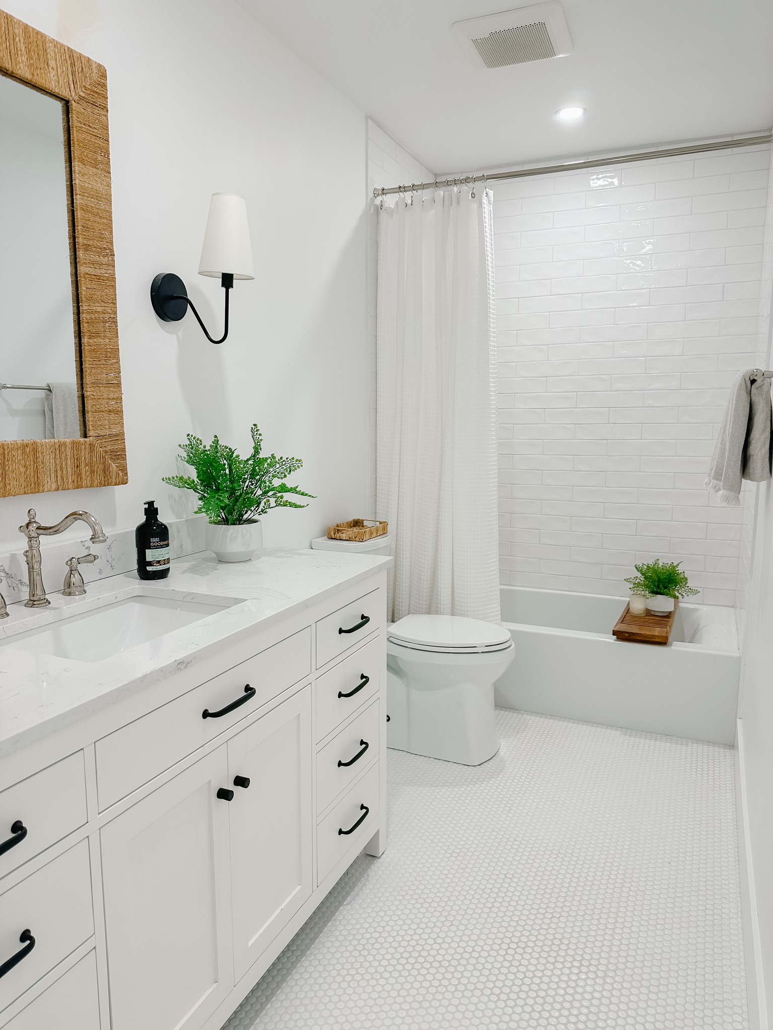 Modern organic bathroom renovation

White tile, white vanity, 60in bathroom vanity, inset vanity, black hardware, hardware dupe, white shower curtain, rattan mirror, faux plants, polished nickel, bath tray, wood bath tray, coastal decor, coastal design

#LTKunder100 #LTKhome #LTKFind
