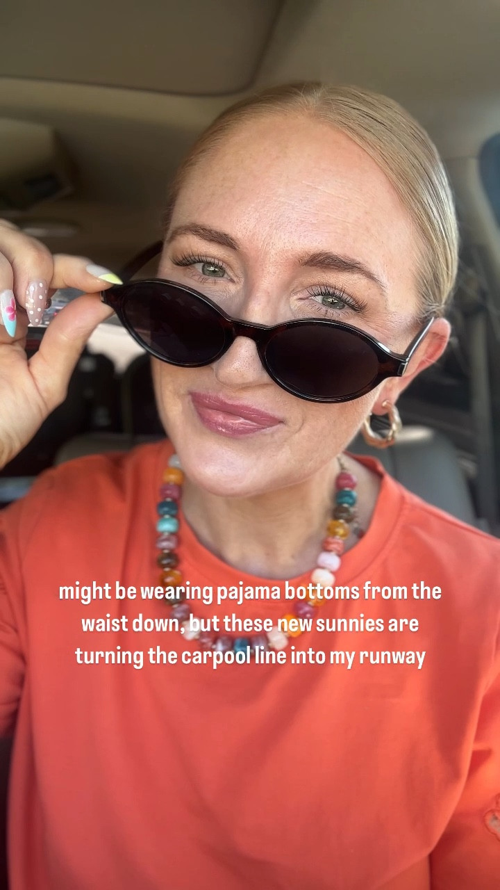 Carpool line, but make it a Vogue runway. 😉 I’m obsessed with how easily a good pair of sunglasses can completely change your entire vibe—even if you’re secretly still wearing your pajama pants. I’m linking my top favorite pairs that look expensive but are totally budget-friendly. Both come in several color options! 

#CarpoolLineFashion #MomHumorReels #ColorfulOutfits #SummerEssentials2026 #AffordableAccessories #OrangeOOTD #StatementSunnies #VogueVibes #MomStyleLife #FunkyJewelry

Amazon sunglasses haul, pop of color outfit ideas, vibrant orange shirt styling, colorful rings and necklace accessories, school pickup line mom outfits, transition reels trends, summer fashion trends 2026, affordable eyewear find, everyday mom luxury style, bright aesthetic outfit inspo, effortless outfit upgrade

#LTKootd #LTKSeasonal #LTKgrwm