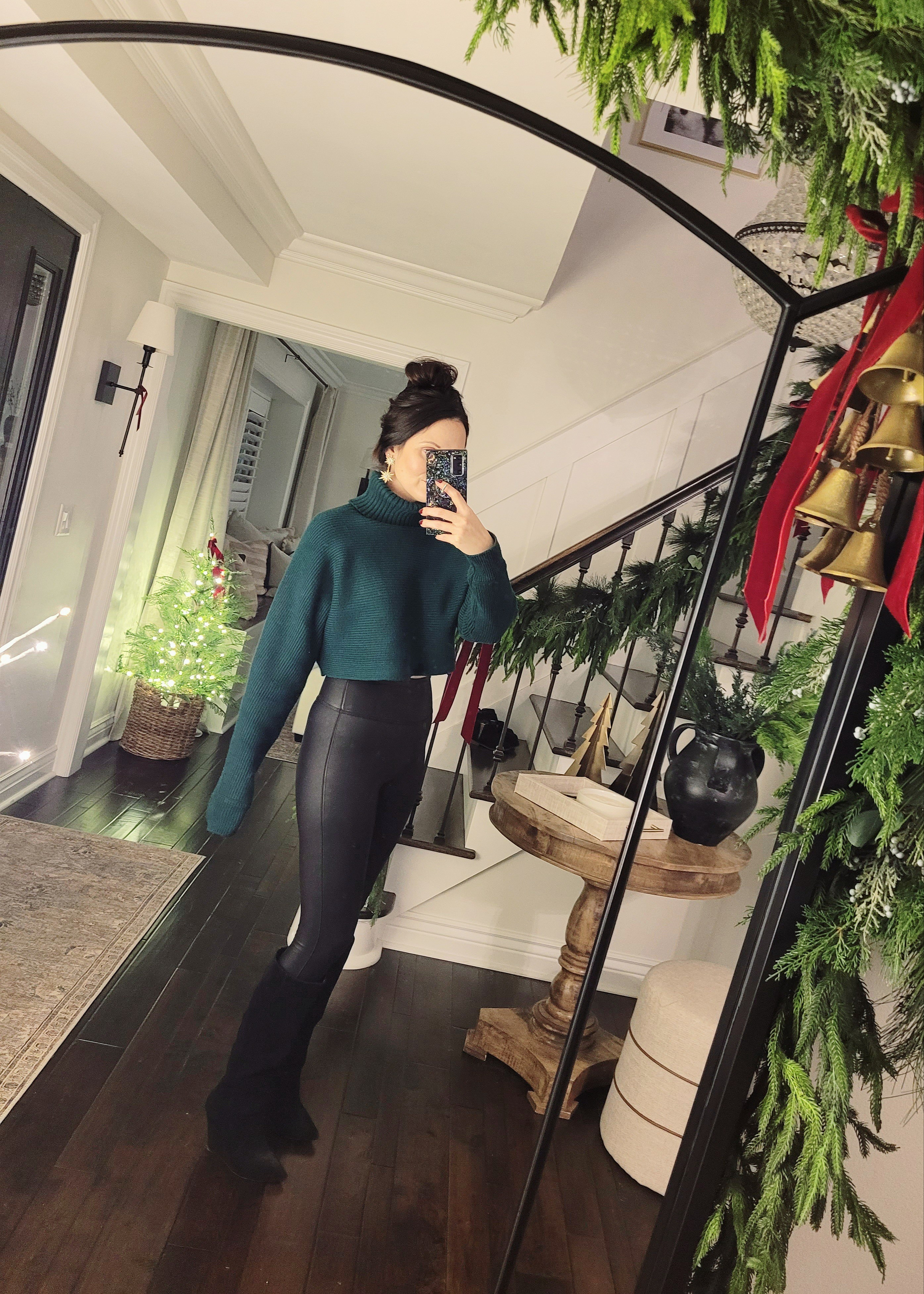 Simple holiday ootd that I wore to a Christmas show last night - cropped sweater with faux leather leggings and black wedge boots. I wore my hair twisted up in this black bow claw clip and it was so cute! This outfit works for hosting family Christmas or a holiday party - cozy but sophisticated! 

#LTKHoliday #LTKSaleAlert #LTKStyleTip