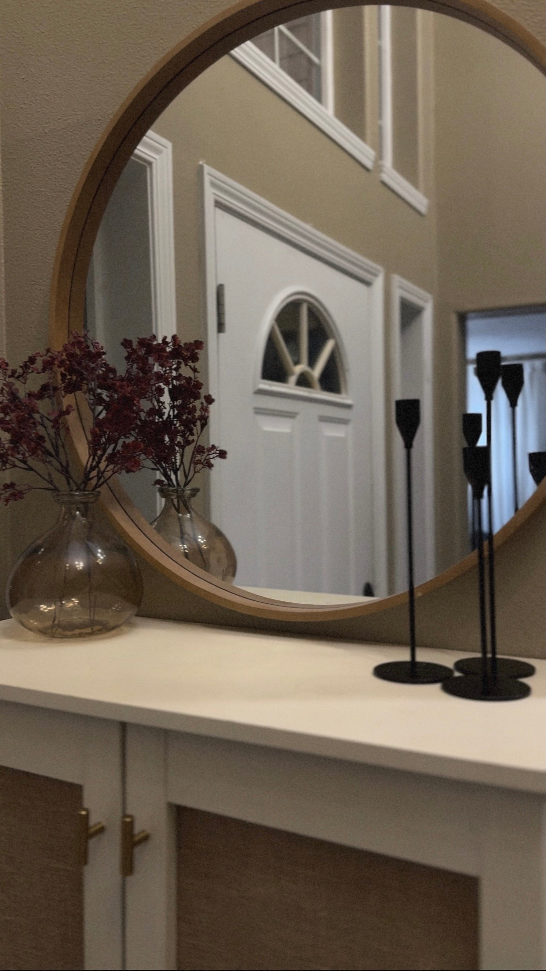 Front Entrance - Mirror, Baby’s Breath stems and candle stick holder

#LTKFindsUnder100 #LTKHome