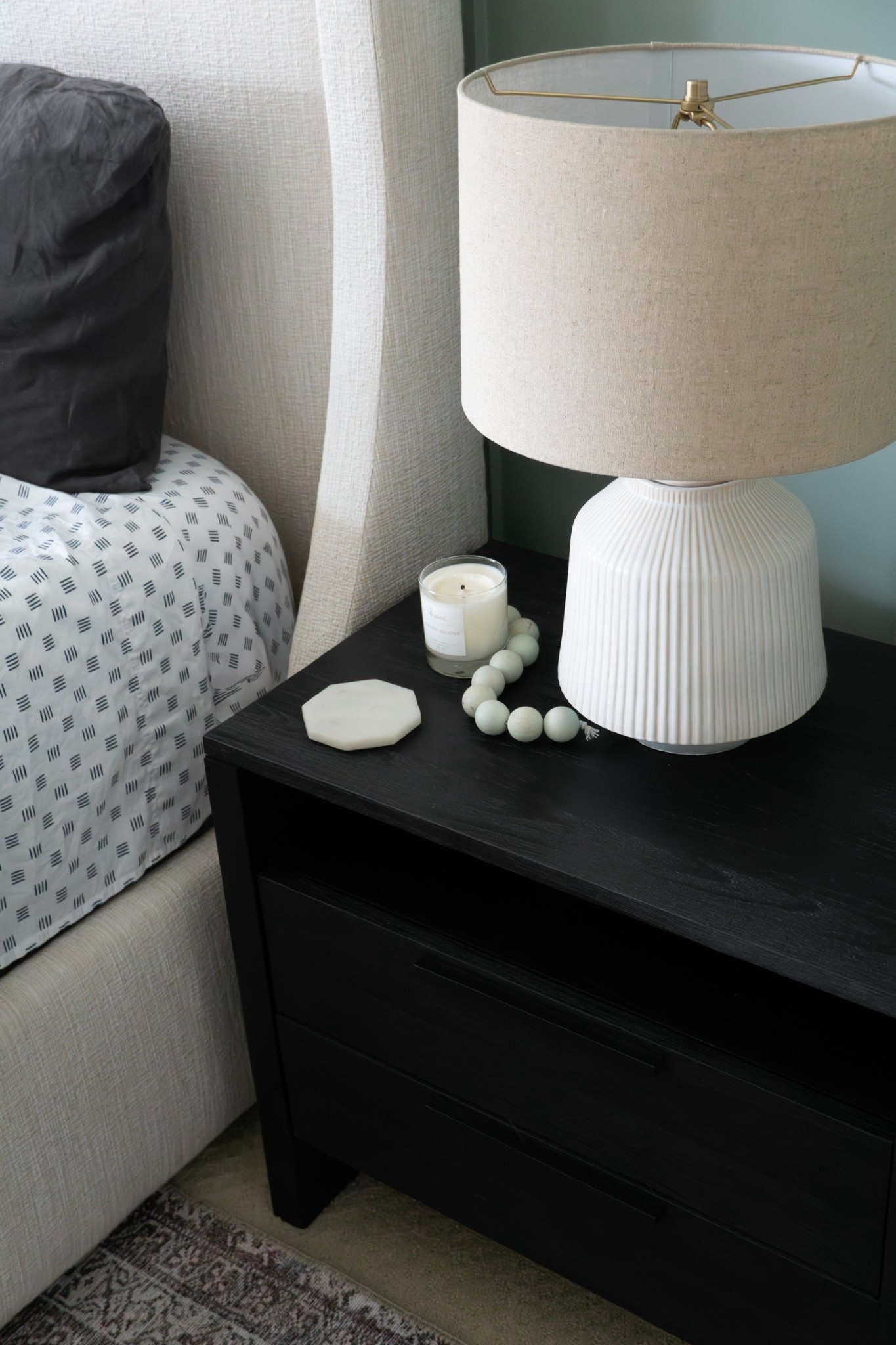 Nightstand styling from our North Oaks project. We kept it simple with a white marble coaster, a candle, a textured table lamp, and decorative beads. 

#LTKStyleTip #LTKFindsUnder50 #LTKHome