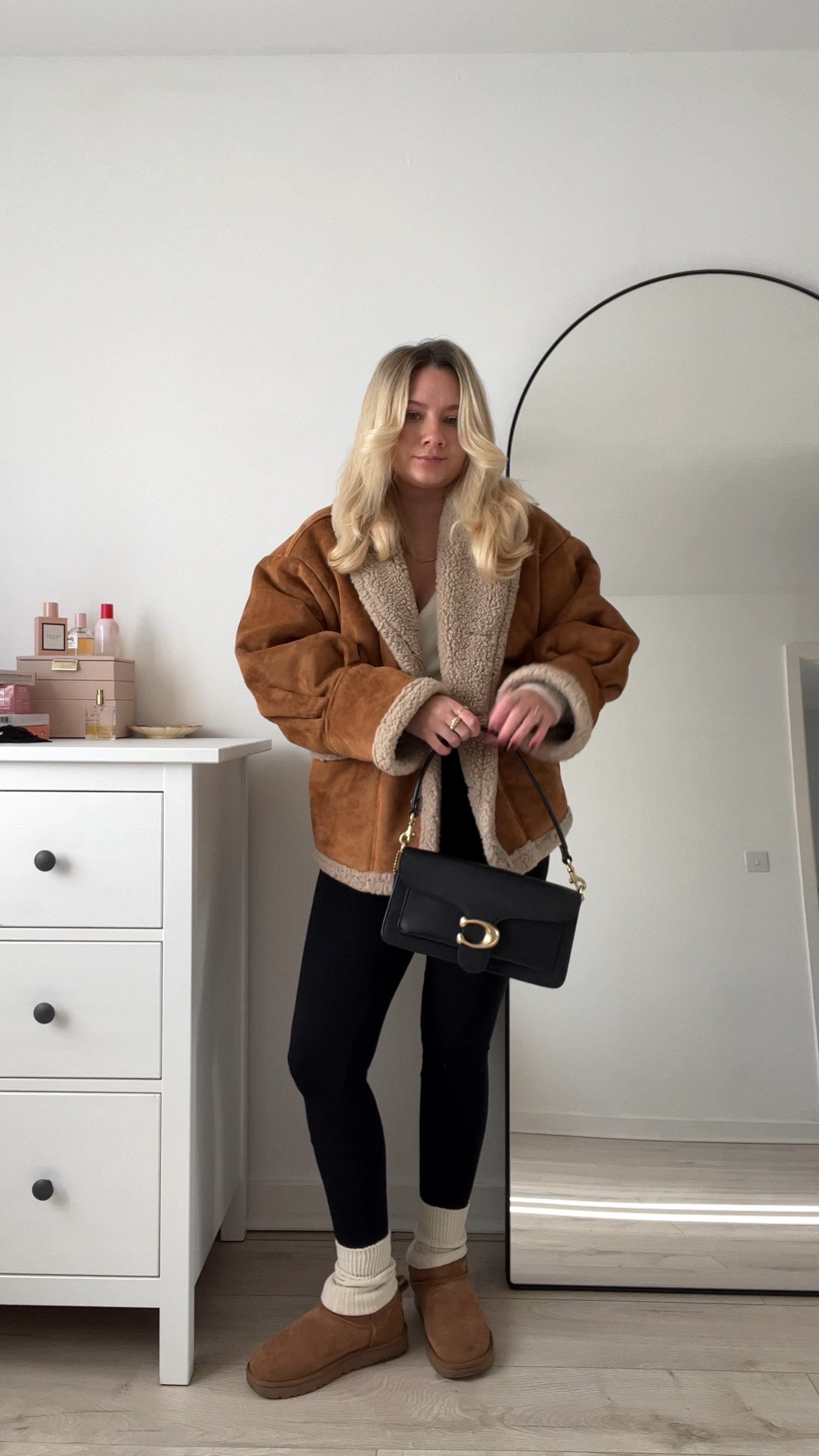 a cosy outfit featuring a black seamless ribbed unitard/jumpsuit, cosy cream socks, brown ugg ultra minis, a cream ivory wraparound fluffy cardigan, an oversized brown shearling coat and a black coach tabby shoulder bag 🫶🏻🧸

#LTKeurope #LTKstyletip #LTKsalealert
