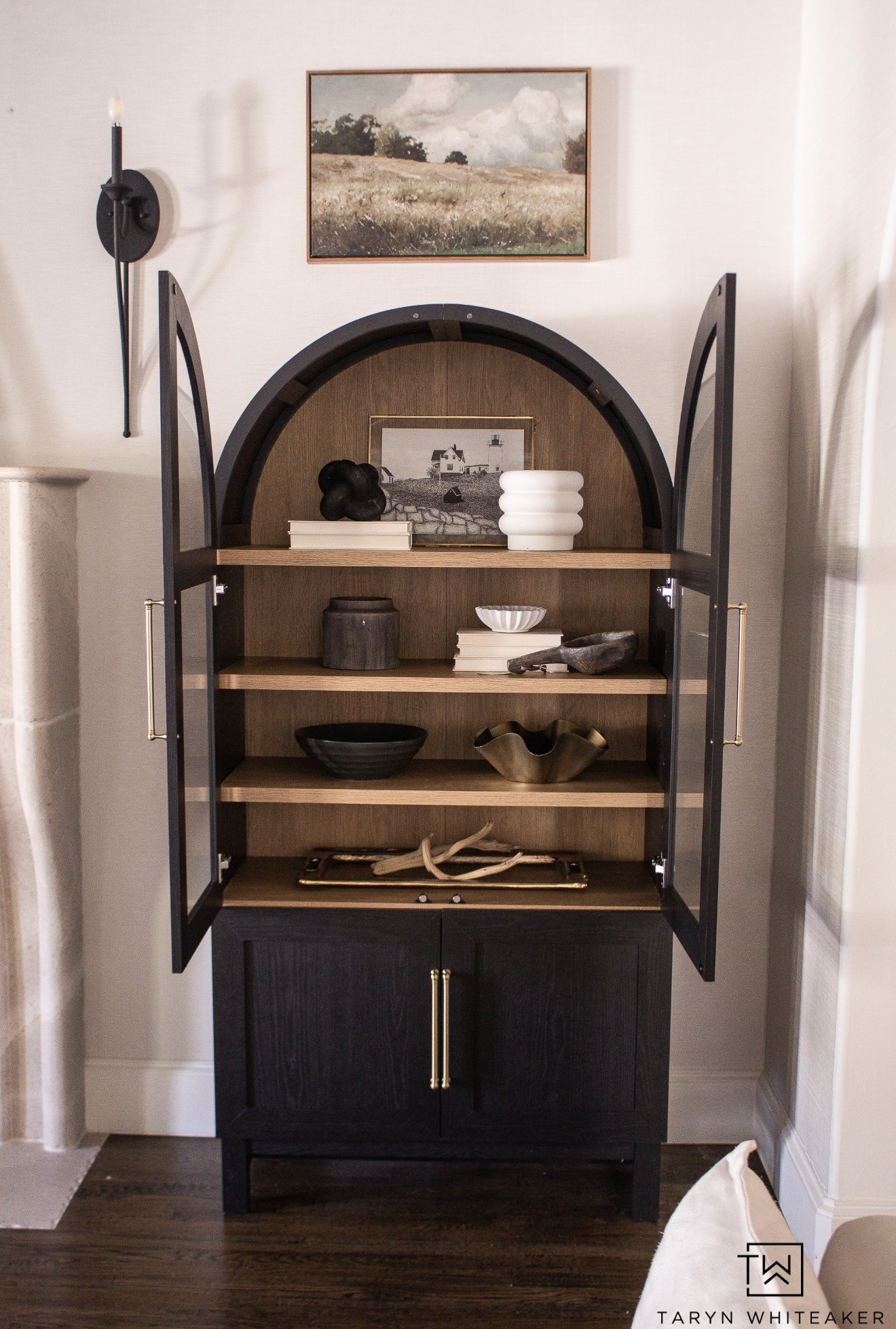 Statement storage piece that doubles as decor. Arched cabinet with a classic silhouette, warm wood interior, and plenty of space to style books, bowls, and collected pieces. Perfect for a living room, dining room, or entryway when you want functional storage that also feels elevated and intentional.

Home decor, arched cabinet, storage cabinet, living room decor, dining room storage, neutral home, modern traditional style, styled shelves, timeless furniture, home organization

#LTKHome #LTKSeasonal #LTKdayinmylife