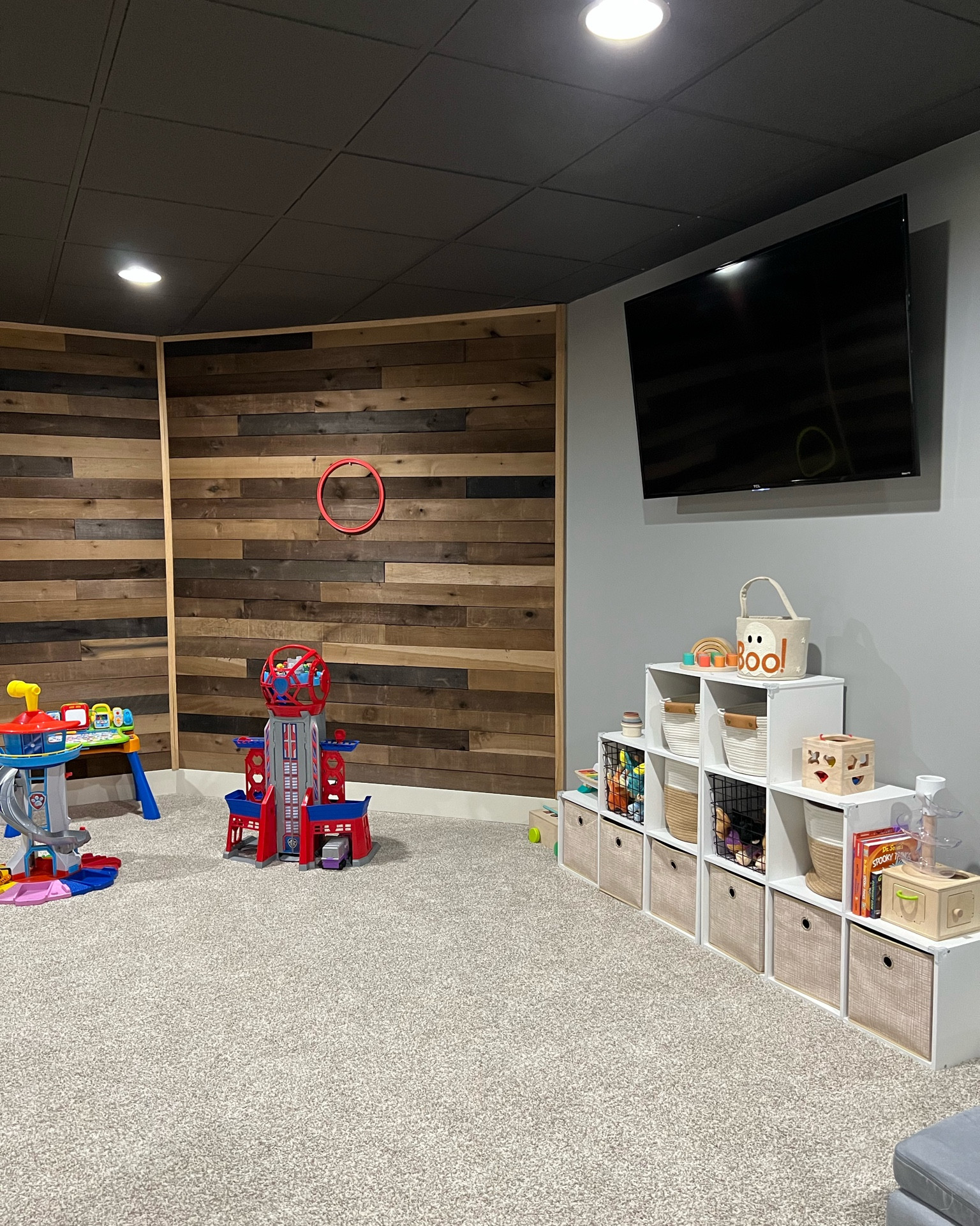 Basement playroom. Accent wall. Playroom ideas. Playroom organization. Cube organization. Wooden toys. Cube organizer. Target home. Home organization. Toddler playroom. Paw patrol toys. 

#LTKfamily #LTKhome
