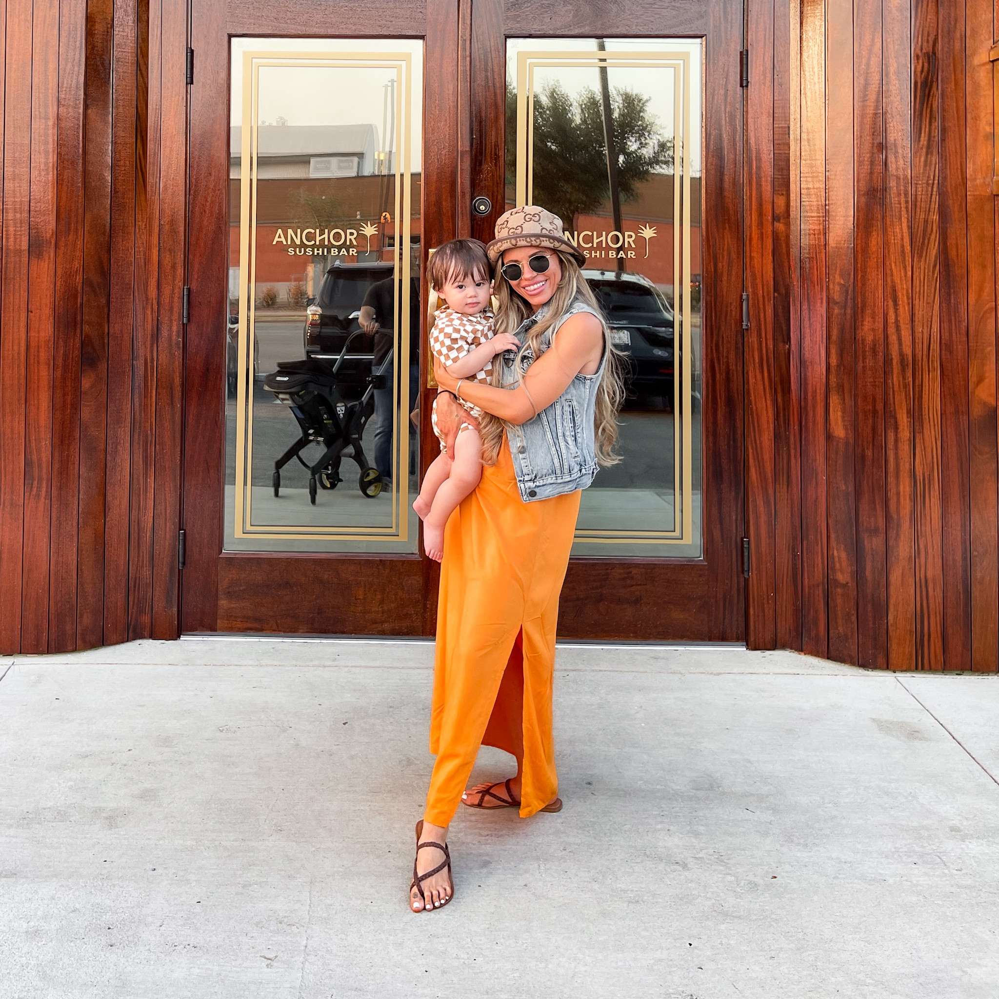 This coordinating mom and son orange and brown look is one of my favorites. I paired a simple sundress from old navy with a denim vest from jcrew, a gucci bucket hat, round rayban sunglasses, and brown leather strappy sandals to create an elevated yet casual outfit. My son is wearing a brown checker pattern short sleeve set from amazon. 

#LTKkids #LTKstyletip #LTKfamily