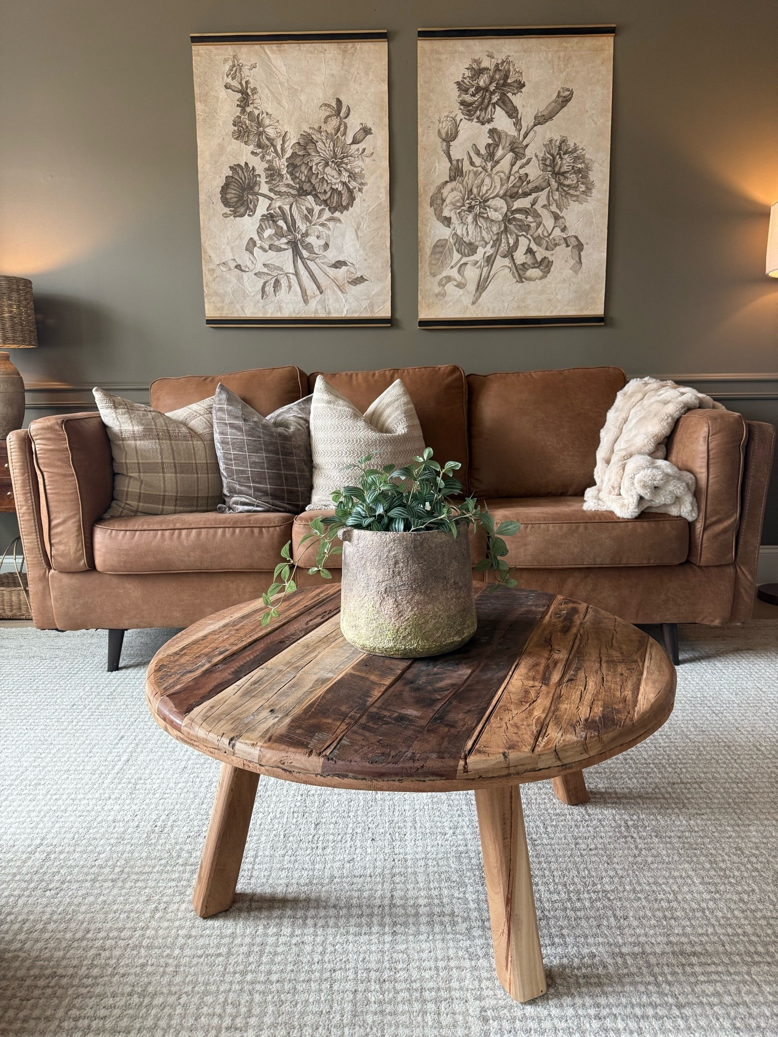 One of my favorite spaces in our home. 🤎

This room combines some of my favorite design elements—a solid wood coffee table, a timeless leather sofa, vintage-inspired tapestries, and layers of warm texture to create a space that feels collected, cozy, and inviting.

If you love organic modern design with a touch of vintage charm, these pieces help create that lived-in, timeless look that never goes out of style.

✨ Solid wood furniture
✨ Leather sofa
✨ Vintage-inspired wall decor
✨ Organic modern style
✨ Warm, collected interiors
✨ Timeless home decor

#LTKHome