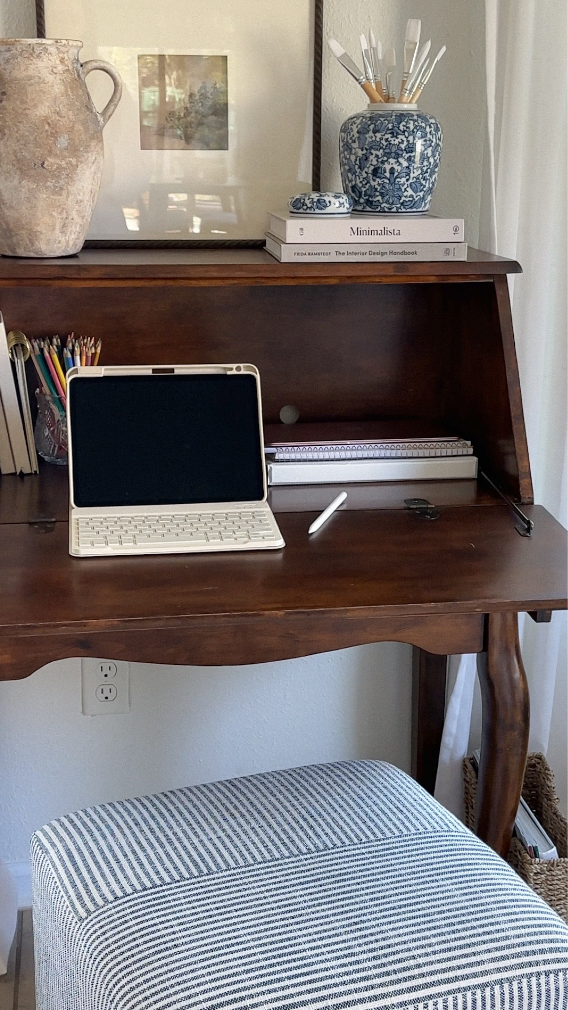 Work / craft space 💻🎨 loving this iPad case with keyboard! Desk was thrifted (exact item: Ashley furniture secretary desk H217-19) 

2025 home trends, wfh desk, wfh essentials, Nancy meyers, Martha Stewart, transitional decor 

#LTKHome