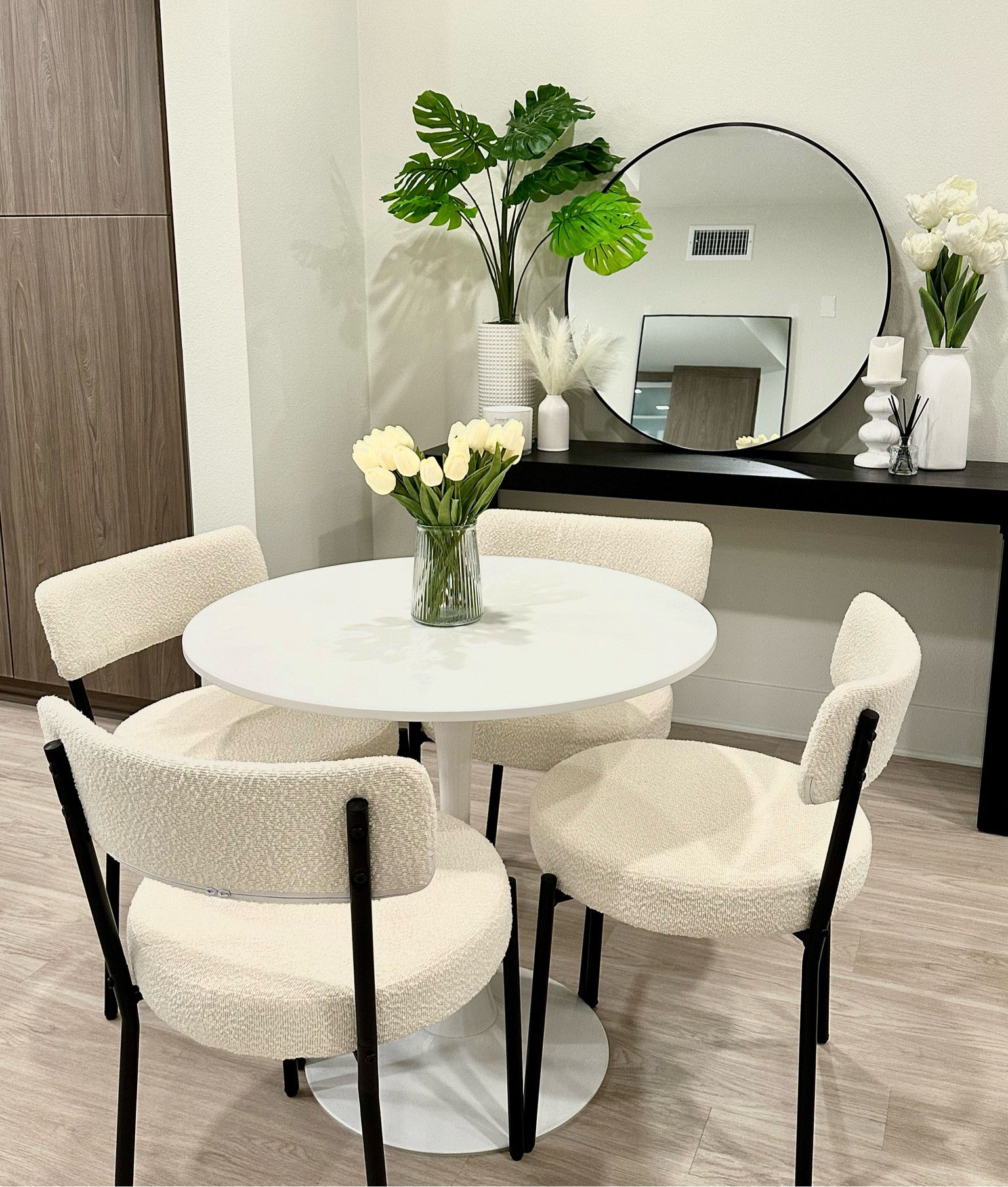 Apartment setup🤍 The exact chairs are linked on my Amazon storefront under apartment finds, but are sold out currently! I linked a couple that look the same💗 The console I got off Facebook marketplace, but you can get the target one and paint it black or keep it the color it is! The faux plants on the console are from TJ Maxx and the candle and candle holder are from HomeGoods! 

#LTKfamily #LTKstyletip #LTKhome
