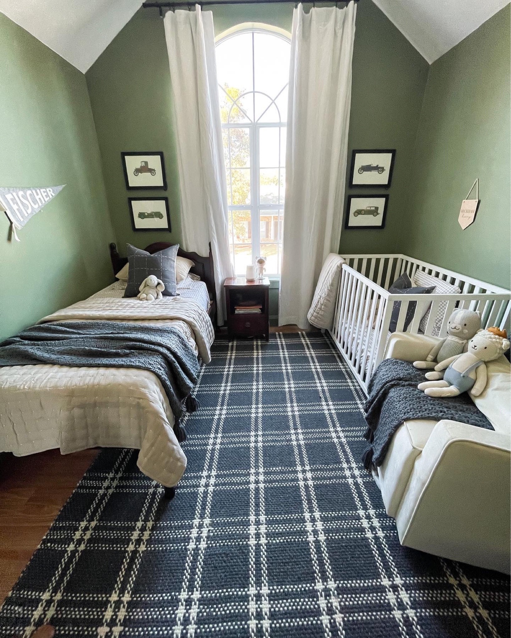 The boys’ shared room! 

Twin bed
Plaid rug
Vintage car prints
Twin bedding
Blue throw blanket
Rocker
Name pendants




#LTKkids #LTKfamily #LTKhome