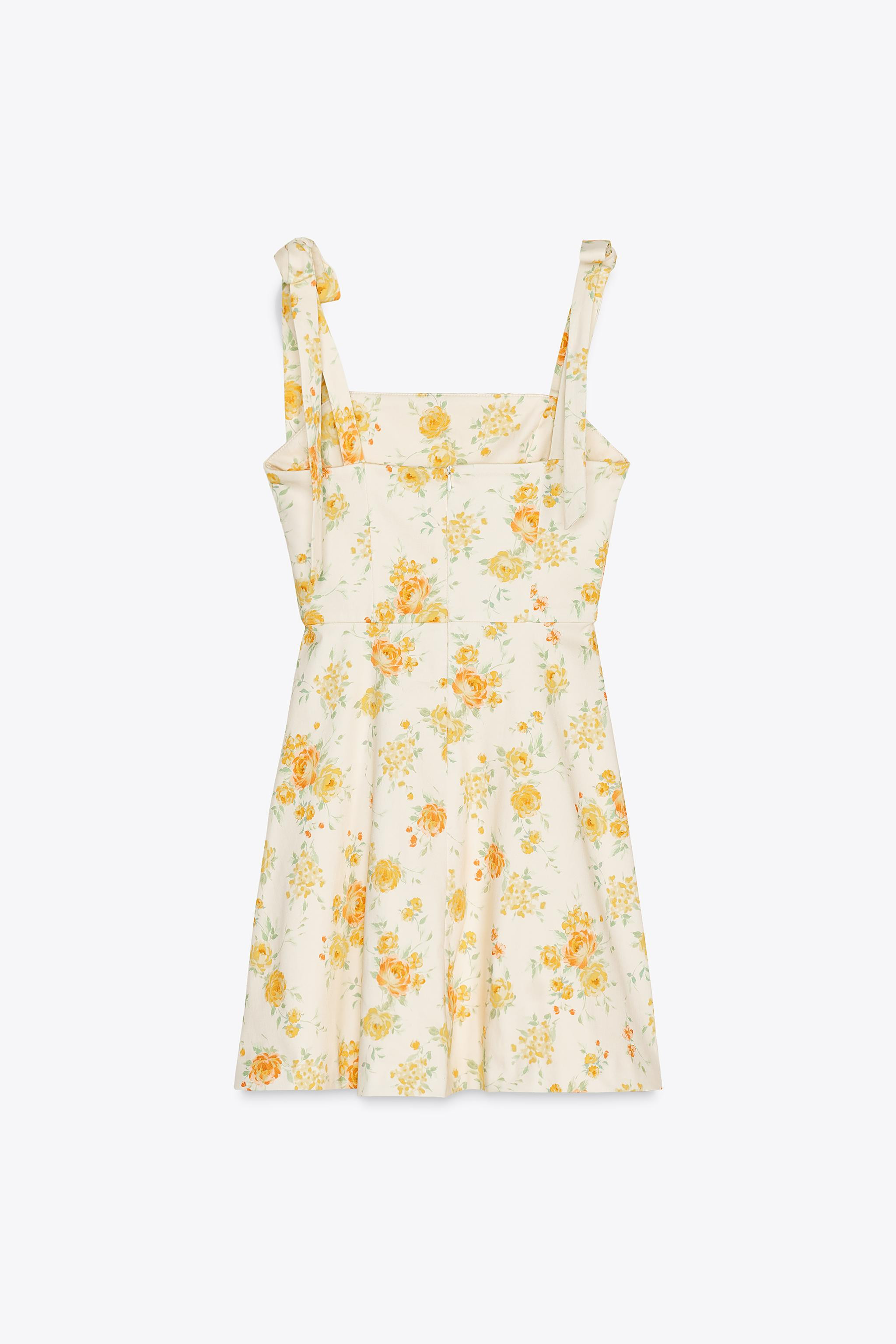 Short straight-neck dress. Straps with bow detail. Matching inner lining. Hidden back in-seam zip... | Zara US