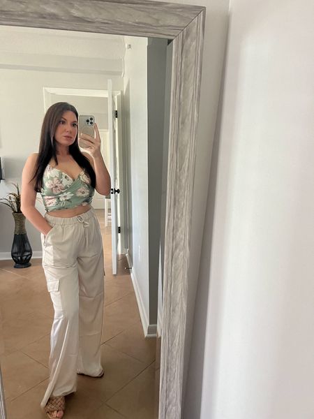 Vacation on my mind. 🐚☀️🌊// If I could wear one outfit for the rest of my life, this would be it! Butttt I will definitely be wearing for vacation and all Spring & Summer! ☺️ 

my  cutie top fits like a glove & has adjustable straps. These cargo satin pants are so comfortable, lightweight and not see through. The only con is they didn’t have a short length so I need to hem them. 

Wearing a small in both. ✨

Vacation Outfit, Abercrombie style, spring outfit, petite style, satin pants, cargo pants, floral top, beach style 

#LTKstyletip #LTKsalealert