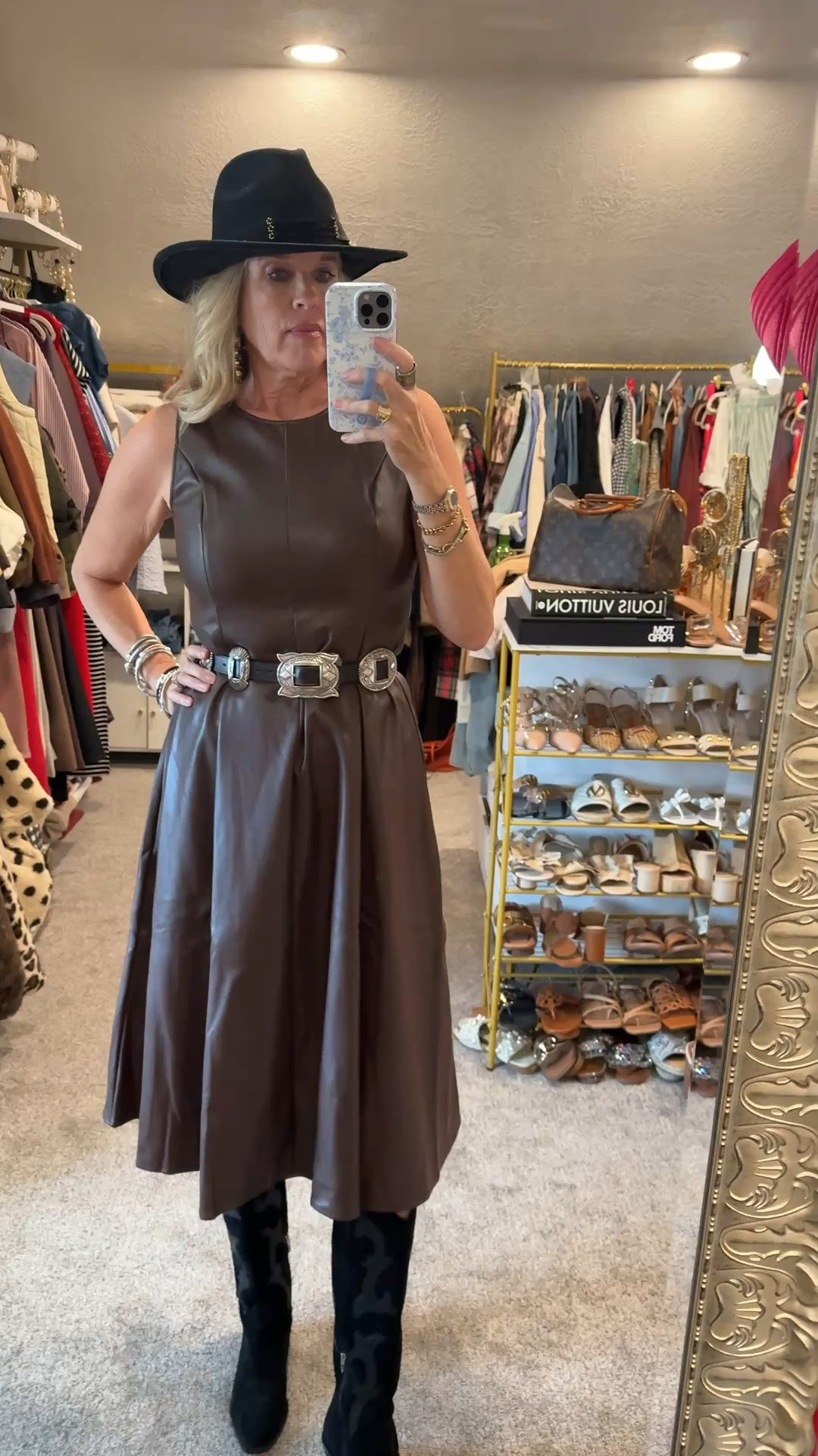 Western Chic Kinda Fall🍂

Fall outfits over 50

Affordable Faux leather tank top mid length dress. Fits tts and comes in 3 colors 
I am wearing a med. 

Black suede dolce vita cowboy boots 

Vintage real sterling silver cocho belt on black leather 
(Linked options similar) 

Black lack of color hat 

Added a hat band and feathers 

Black and natural wooden beaded hoops and mix of designer bracelets

#LTKgrwm #LTKootd #LTKOver40