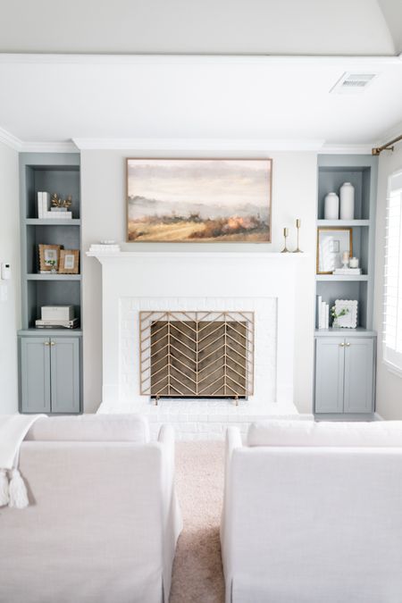 One of y favorite transformations in our home so far! We turned this space of our bedroom into a cozy spot with accent chairs, built in bookcases, and fresh paint! Added a frame tv because I love the look of it and this herringbone fireplace screen is from Amazon  

#LTKhome