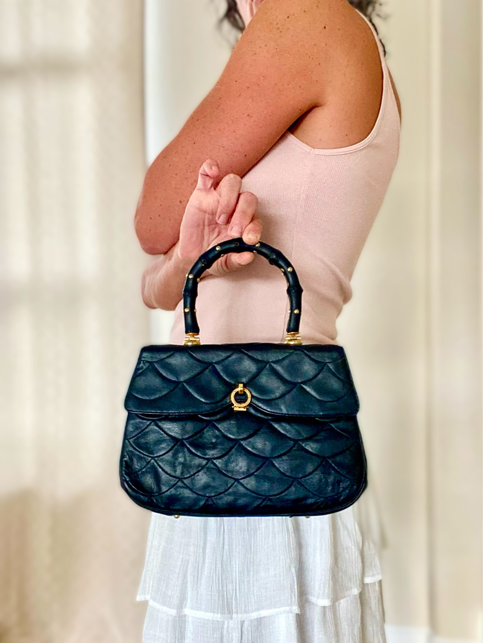 Handbag collectors, this is a real find!  A late 1960s era quilted skin leather top handle clasp bag with studs and a silk lining! A truly special, one of a kind treasure! Currently 25% off on Etsy’s cyber sales!

#LTKfindsunder100 #LTKitbag #LTKCyberWeek