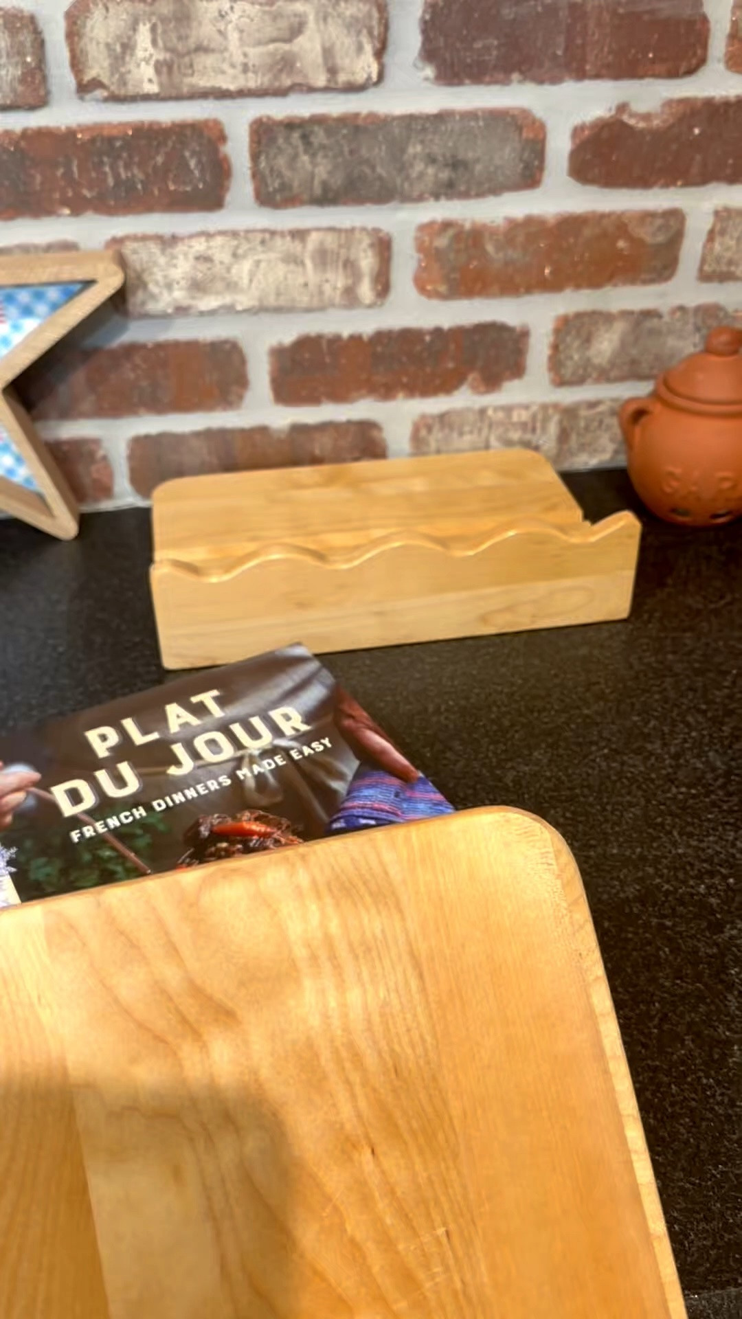 Scalloped Maple Wood Cookbook Stand That Doubles as a Cutting Board 🤍🍞

One of those kitchen finds that’s both pretty and actually useful 🤍 This scalloped maple wood cookbook stand keeps recipes, cookbooks, or your iPad propped up hands-free while cooking, and the removable board doubles as a cutting board or serving tray 🍞🧀 I love the warm natural wood tone for a cozy, elevated kitchen counter look, especially styled with neutral linens and everyday essentials. It folds flat for storage, feels sturdy and well-made, and looks beautiful left out on the counter even when not in use ✨ Perfect for home cooks, bakers, entertaining, or a thoughtful housewarming or hostess gift.

Scalloped cookbook stand, maple wood kitchen decor, wooden recipe book holder, iPad stand for kitchen, neutral kitchen accessories, charcuterie board ideas, cutting board serving tray, cozy kitchen counter decor, functional kitchen finds, Amazon home finds 🤍

#LTKFindsUnder50 #LTKFindsUnder50