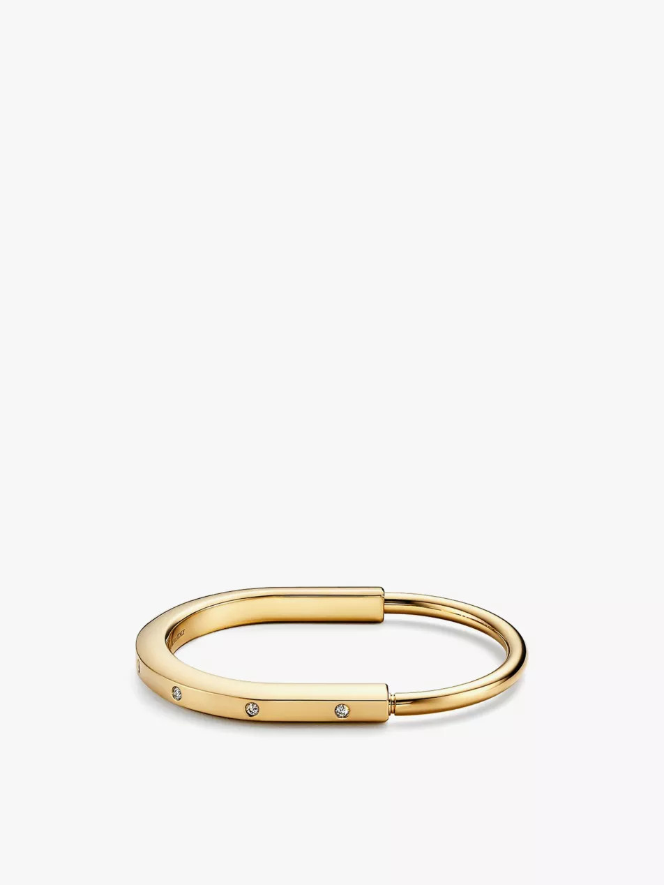 Tiffany Lock 18ct yellow-gold and 0.31ct diamond bangle bracelet | Selfridges
