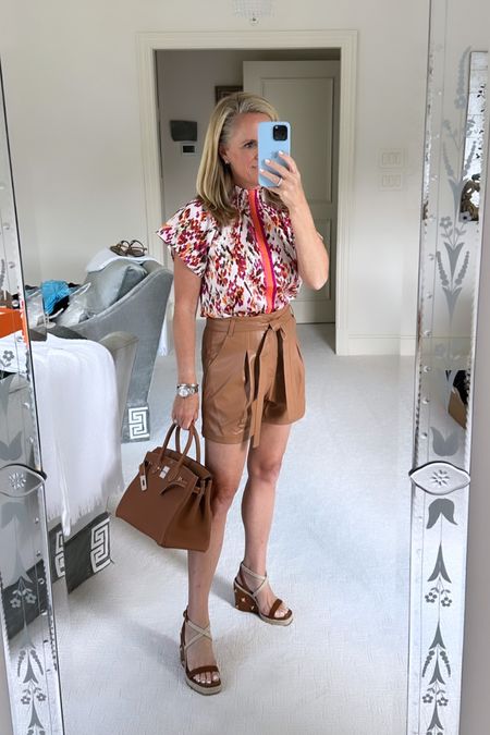 The perfect fall transition top
Silky ivory, top with magenta, Brown, and burgundy, watercolor print
Brown faux leather shorts
Both under $100 from Avara
Valentino, Roman stead, quilted leather wedges 

#LTKover40 #LTKfindsunder100 #LTKstyletip