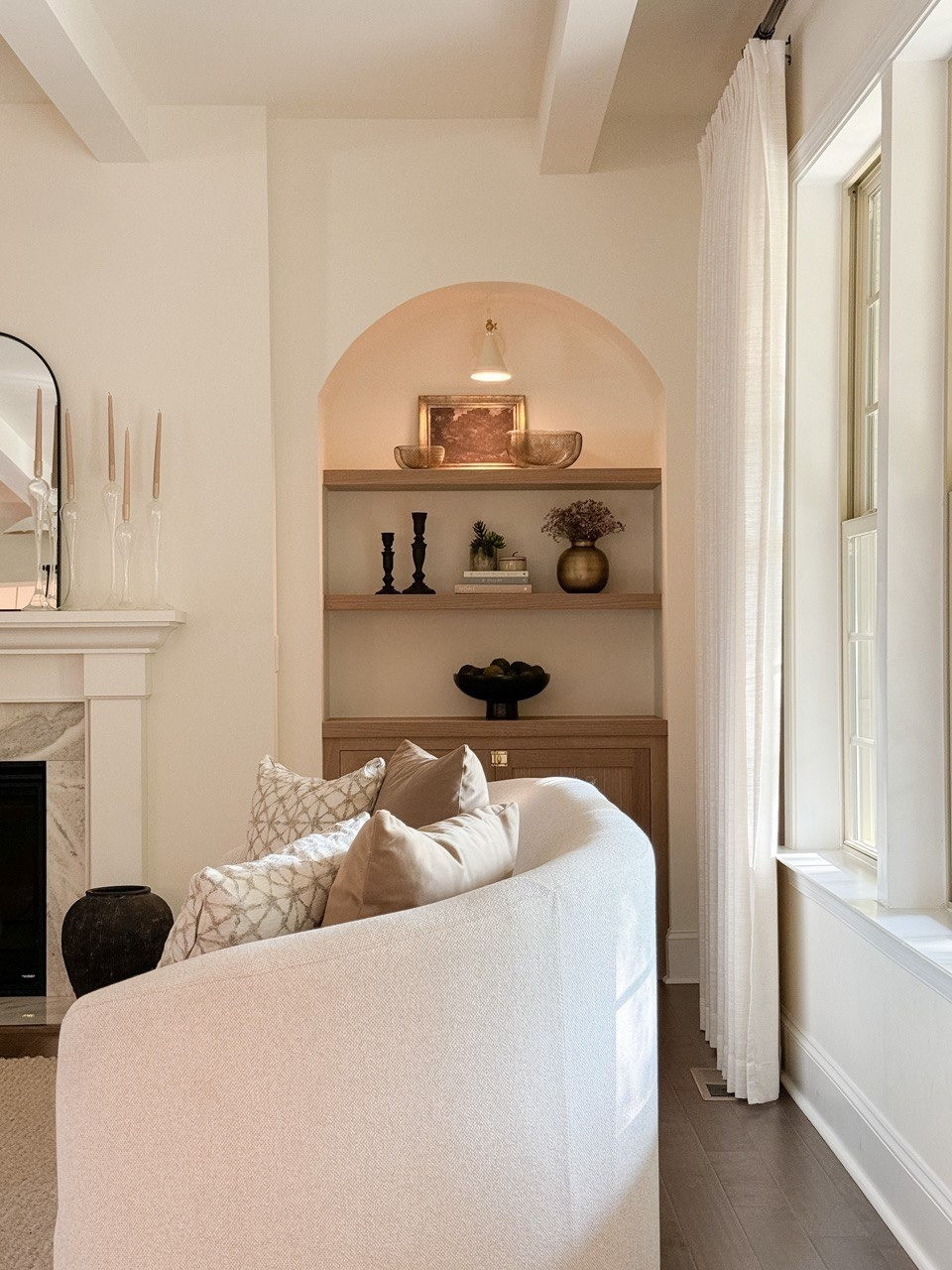 Living Room. Upholstered Sofa, Moss Bolls, Liz Linan Drape Pleated, Ceiling Light, Brass Wire Decorative Bowl, 1 Light Wall Sconce, Cogan Armed Sconce, Area Rug, Moody Trees Framed Wall Canvas Board. 

#LTKHome