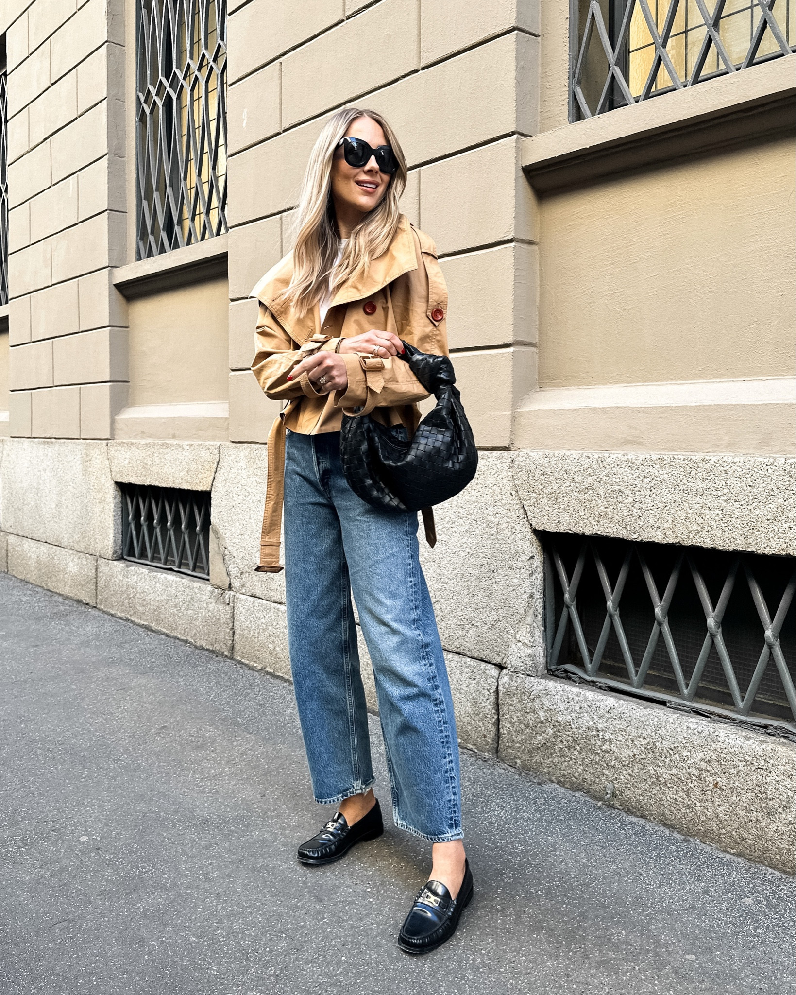 Fashion Jackson wearing cropped trench coat (tts) AGOLDE jeans, black loafers, bottega handbag, #fashionjackson #springoutfits #trench 

#LTKstyletip #LTKshoecrush