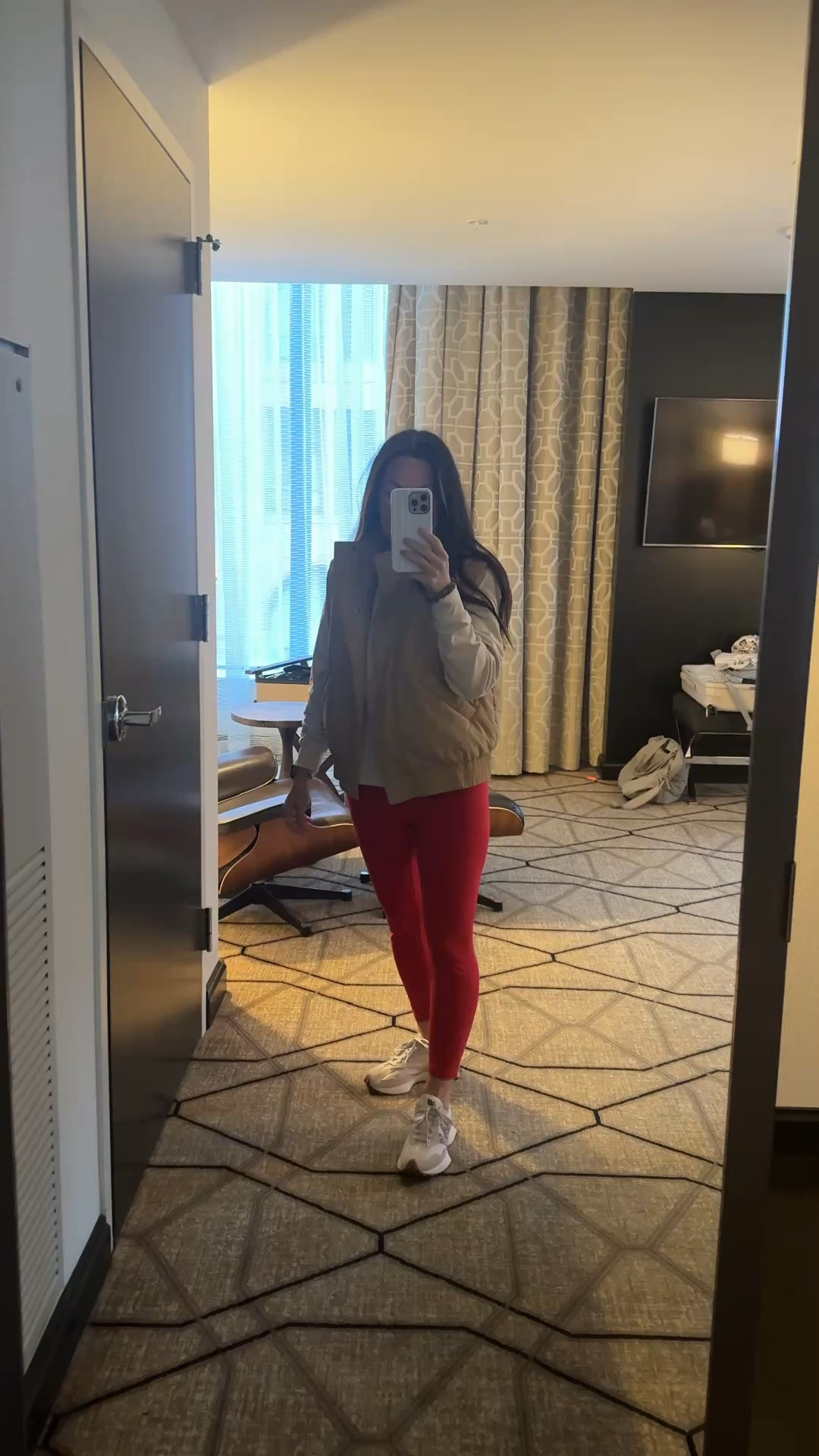 The perfect casual fall outfit for travel days, weekend errands, and staying comfortable on the go! I love an easy athleisure outfit that still looks put together, and this quilted vest layered over a neutral long sleeve top with red leggings and white sneakers is such a cute combination. Perfect for a comfy airport outfit, road trip outfit, casual weekend look, school drop-off, or everyday fall outfit. Fall outfits, fall outfits women over 50, If you’re looking for fall athleisure outfit ideas, comfortable travel outfits for women, or easy ways to style a quilted vest with leggings, this is such a simple look to recreate! Shop my outfit details here on LTK.