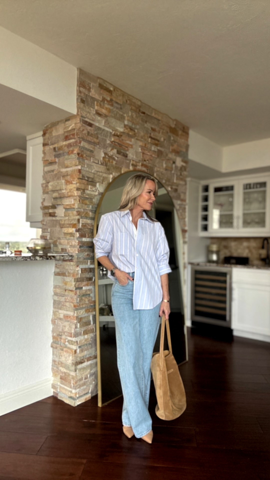 An elevated twist on a classic: this striped button-up has ruched sleeves that stay perfectly mid-arm. Paired with wide-leg denim + suede tote for the ultimate everyday uniform. Linking this exact look + similar finds you’ll love!

#LTKOver40 #LTKWorkwear #LTKStyleTip